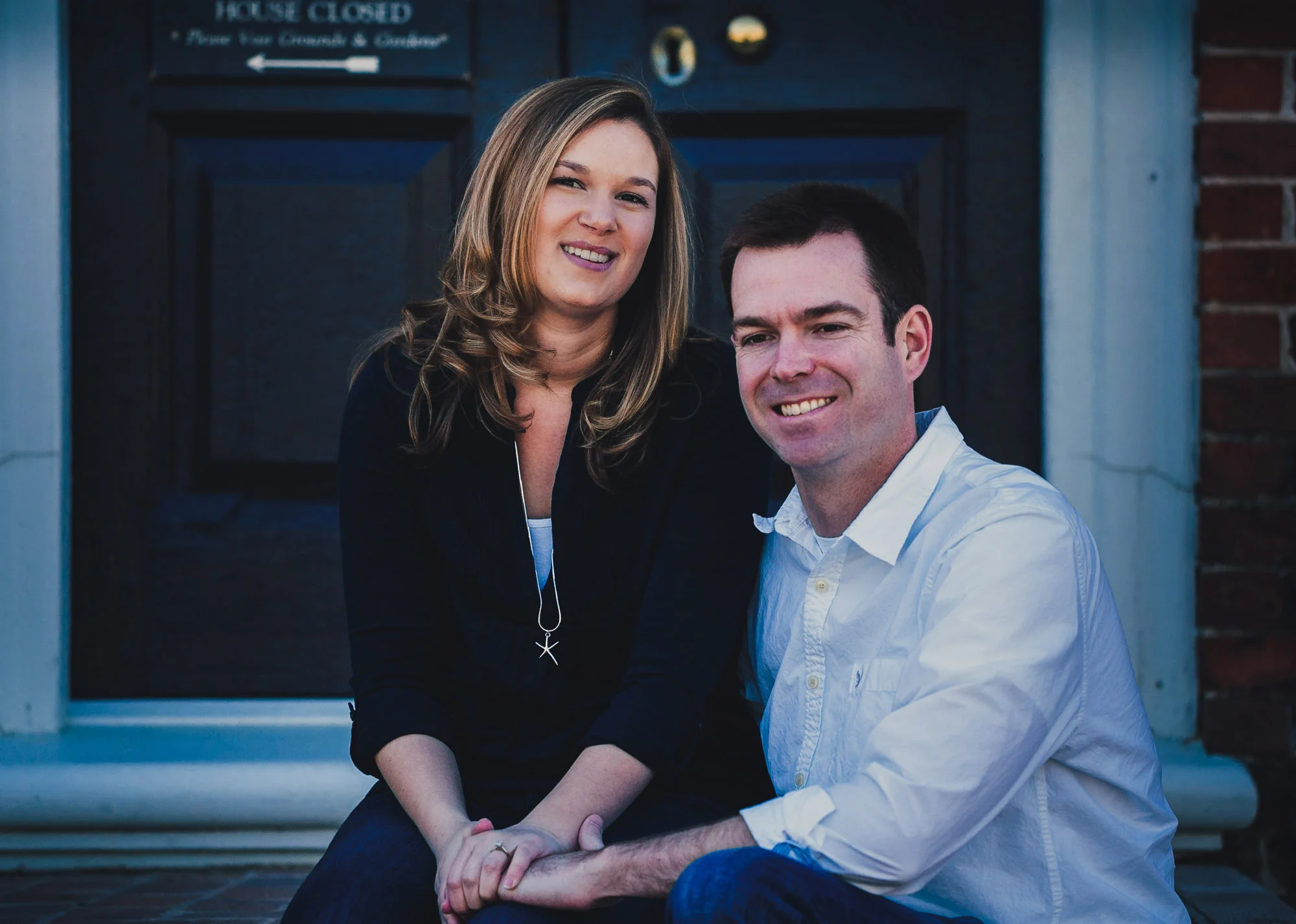couple smiling on step.jpg
