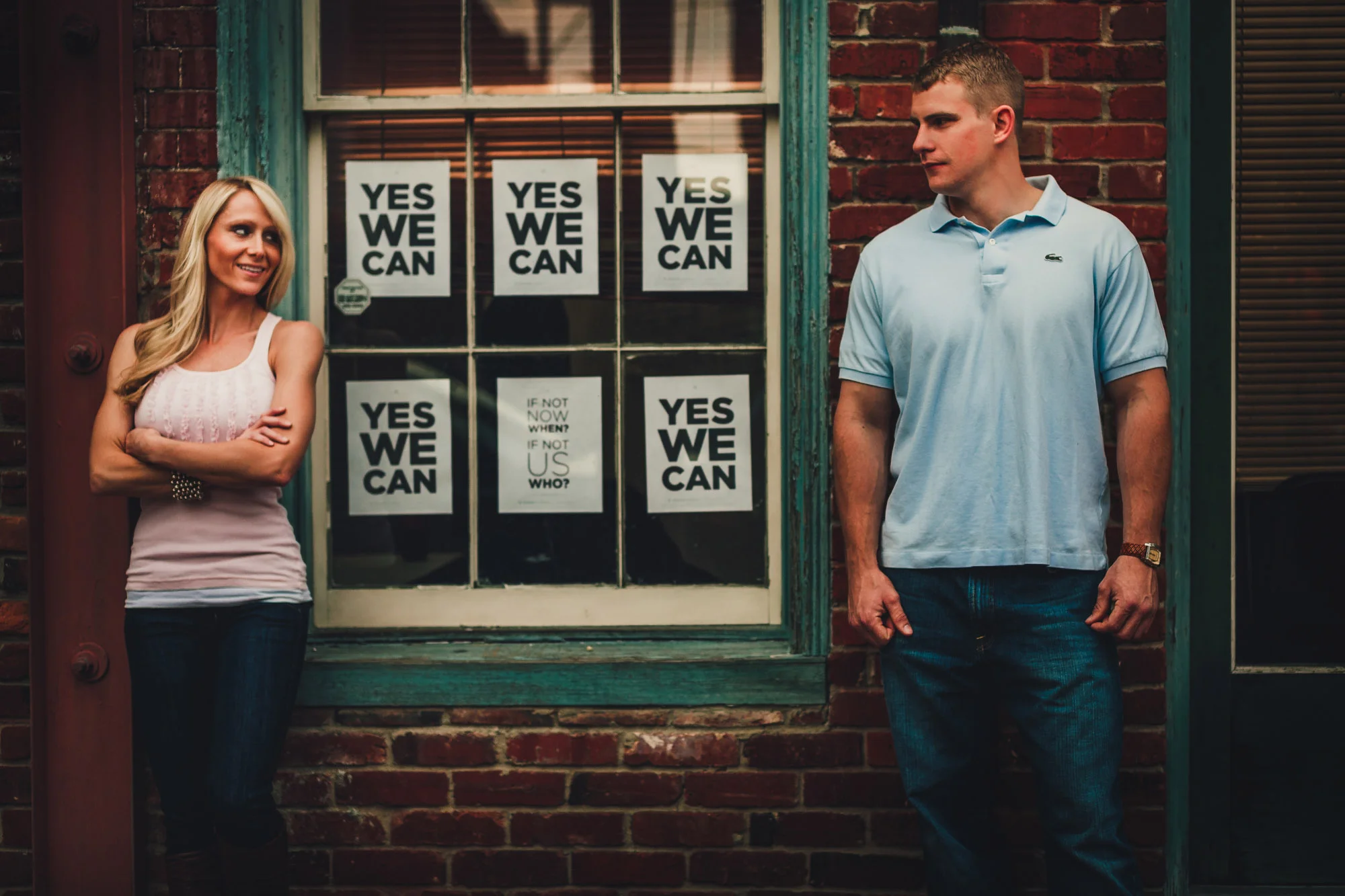 couple standign before window signs.jpg