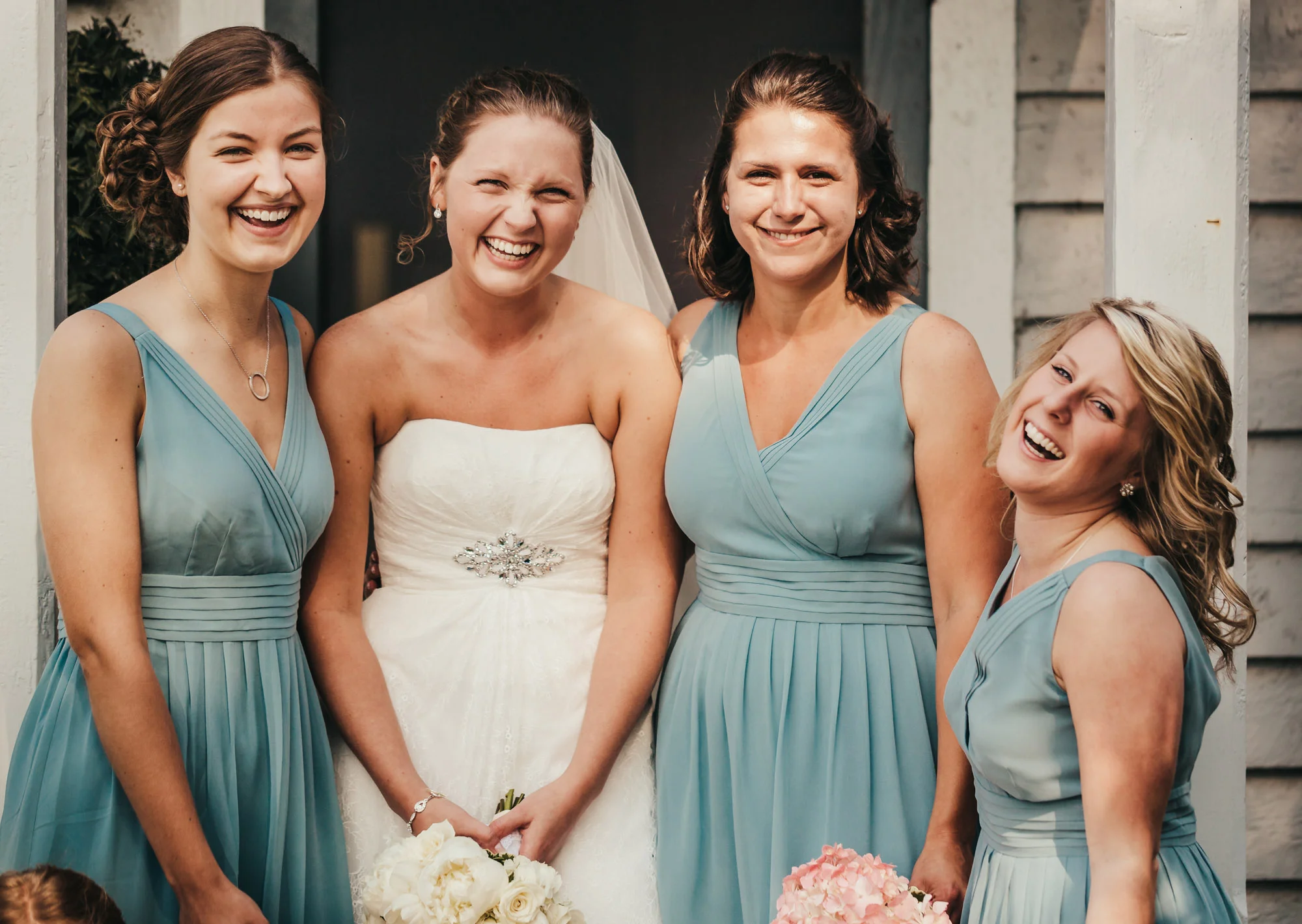 bride and bridesmaids laughing.jpg