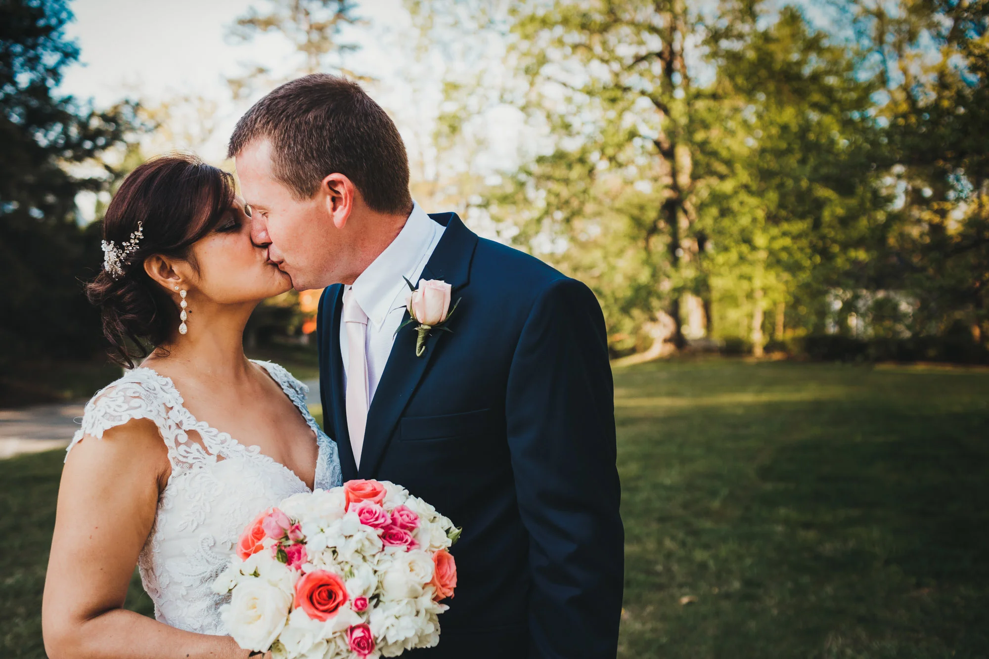 bride and groom kissing after wedding.jpg