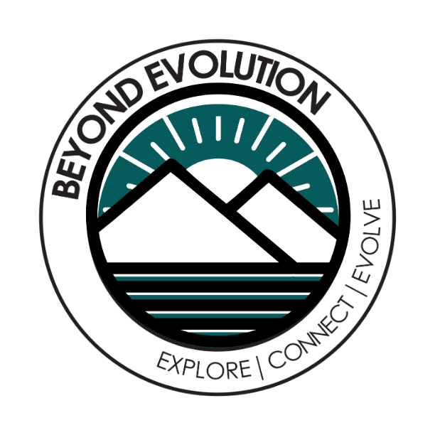 Empty room with white walls, wooden floor, black ceiling, and a black wall-mounted shoe rack on the back wall filled with black shoes. There is a door on the right side and a potted plant in the corner.