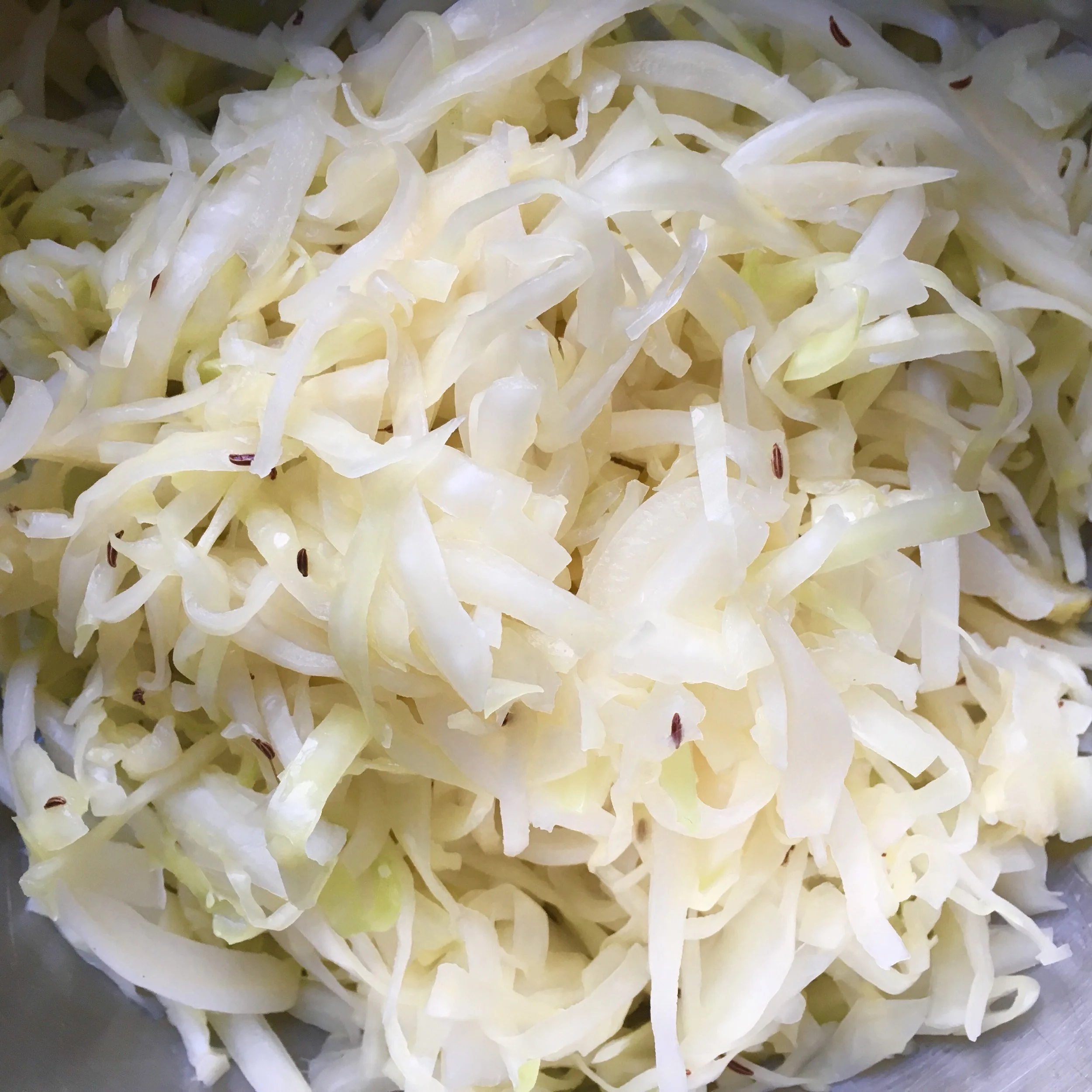 You need to massage the salt into the cabbage for a bit to yield enough brine. If it is too dry (which often occurs at the end of the winter months, you can top it up with more brine (see details in the recipe).