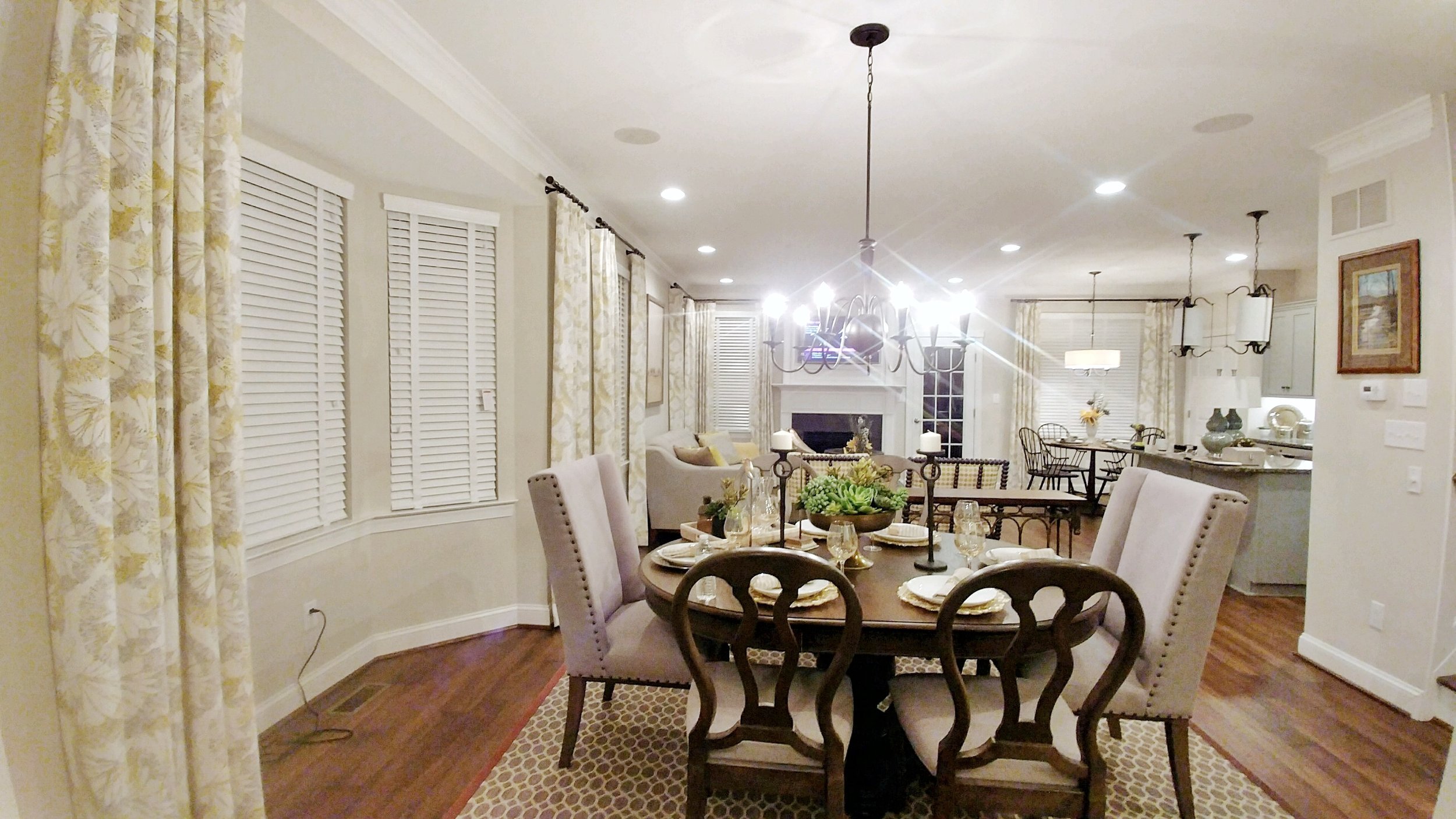Custom white window blinds throughout dining room and kitchen by 3rdGenBlinds