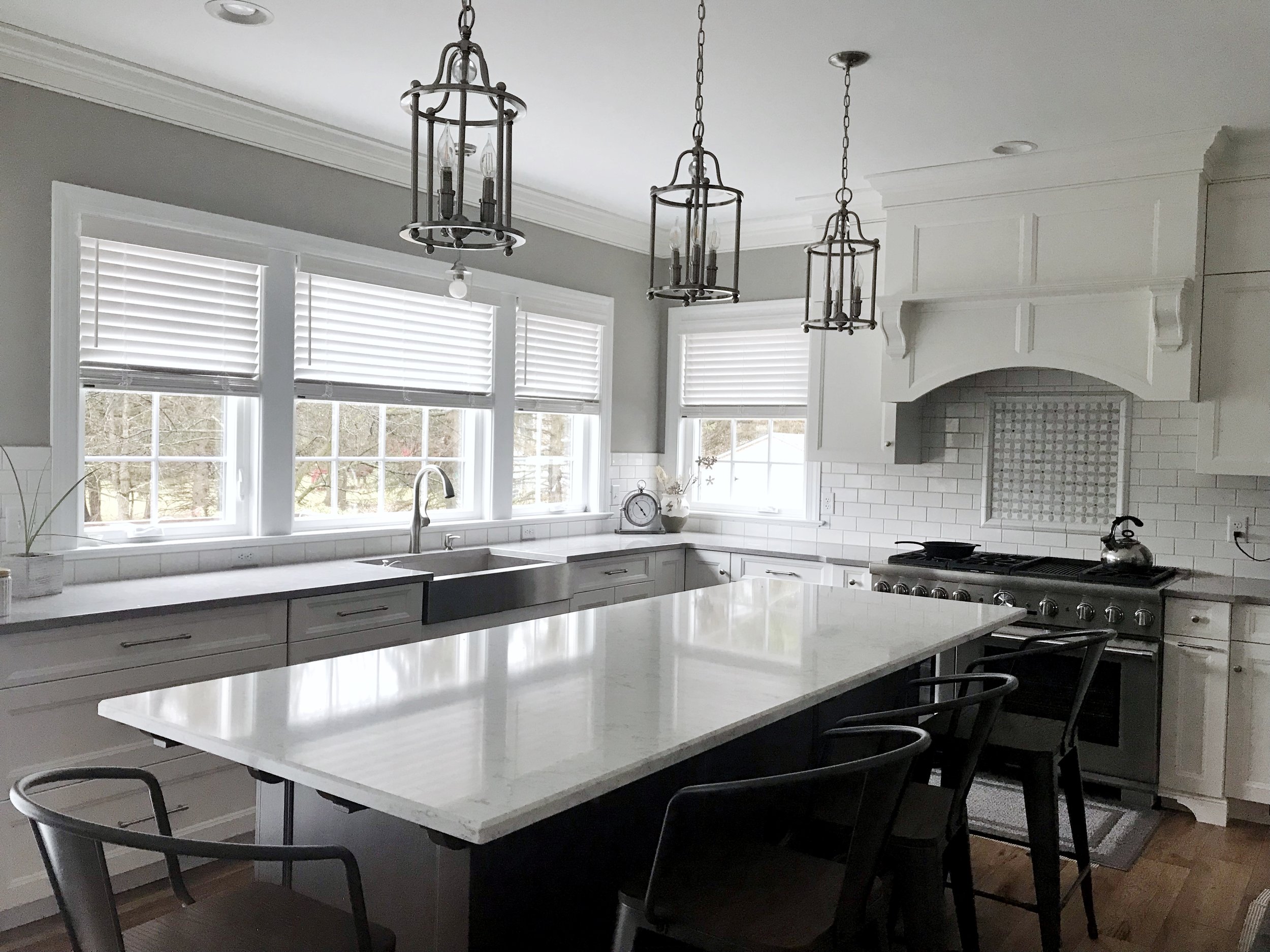 Custom white window blinds in kitchen by 3rdGenBlinds