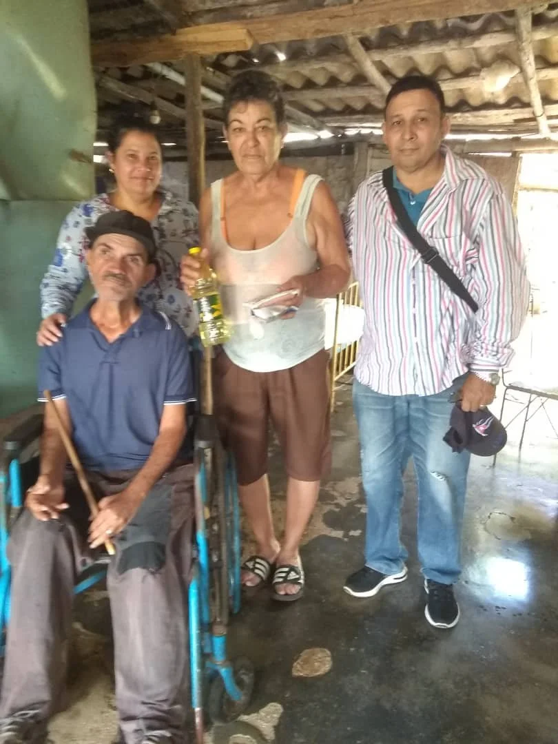 New family being helped at new location.jpeg