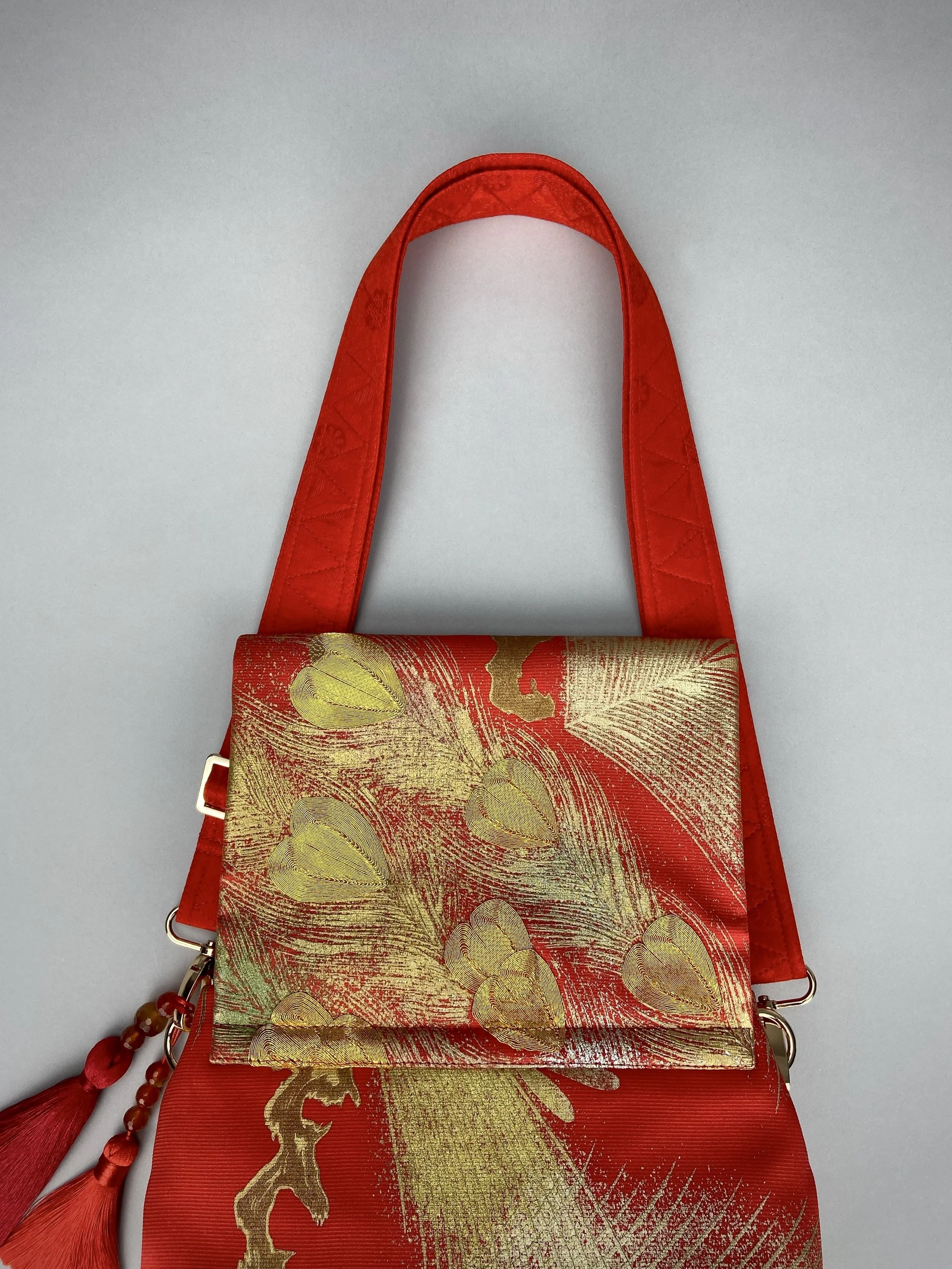 Vermillion red vintage kimono silk evening bag with gold Peacock feather design by Kirsty Chivers
