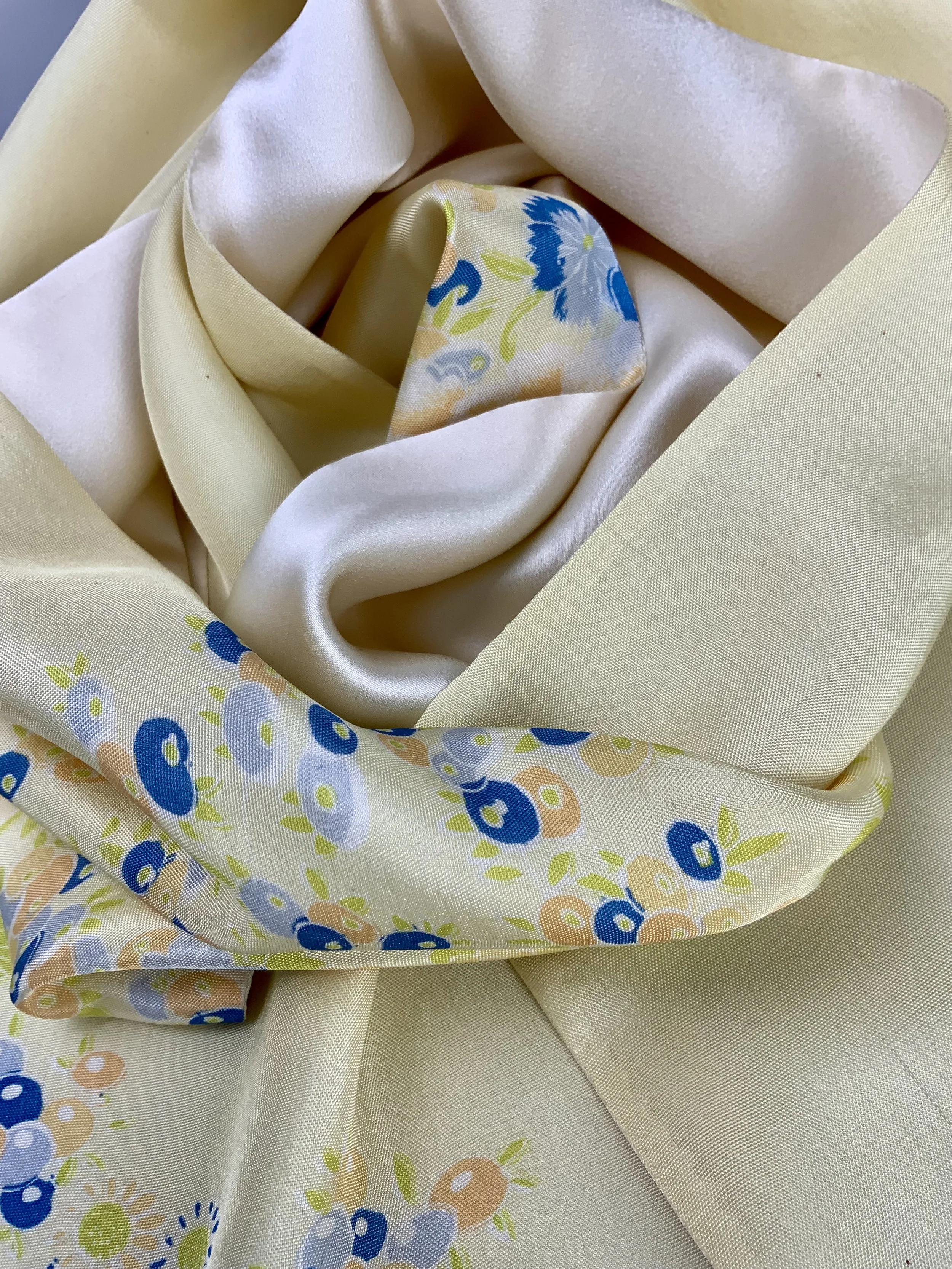 Closeup of yellow scarf with blossom print handmade from kimono fabric and silk satin by Kirsty Chivers