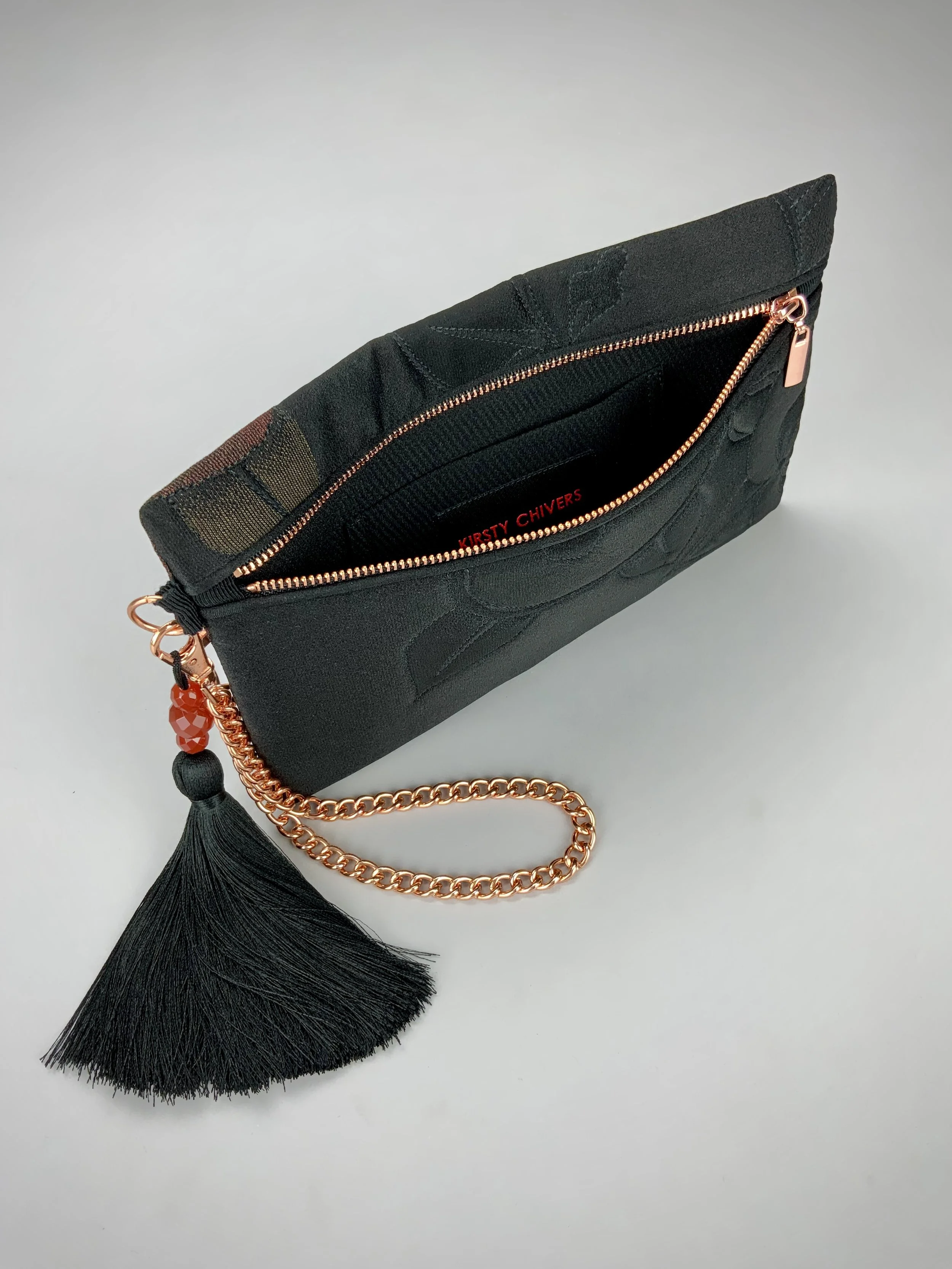 Interior of quilted black clutch purse with tassel & Carnelian beads, made from vintage Japanese kimono silk