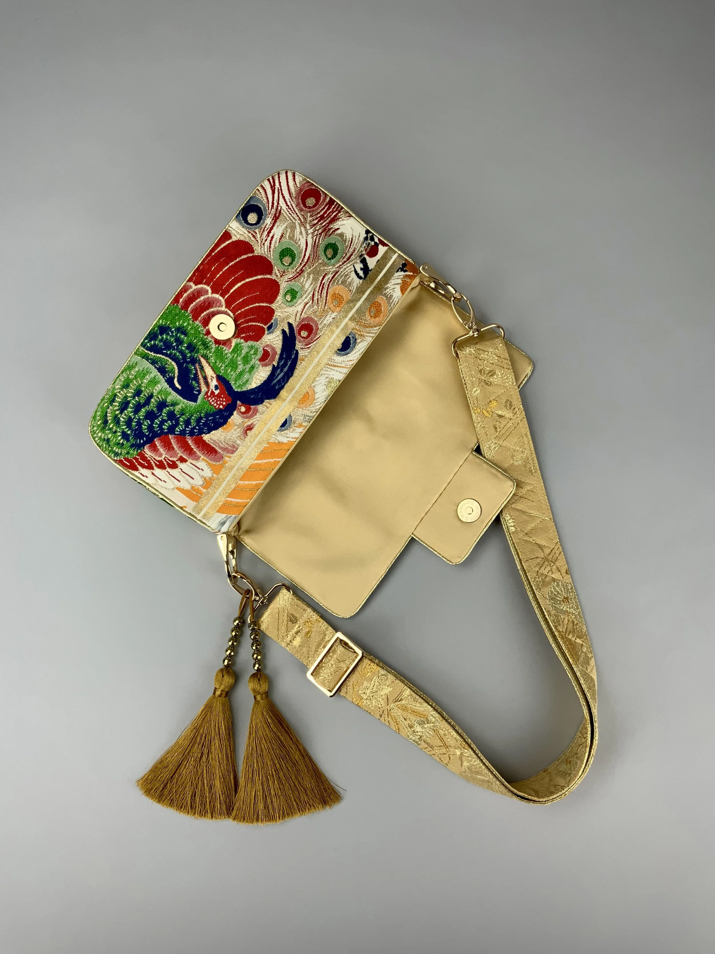 Unique evening bag in vintage obi silk with peacock, pine motifs & gold accents by Kirsty Chivers