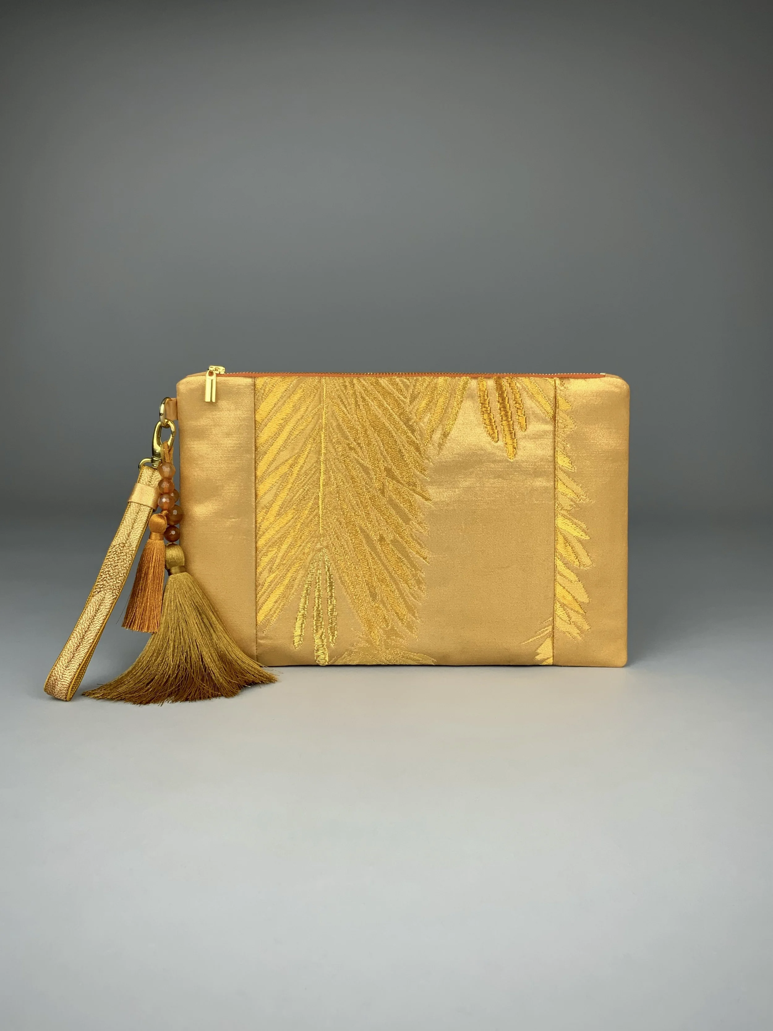 Glittery gold clutch with abstract leaf design, handmade from vintage obi silk by Kirsty Chivers