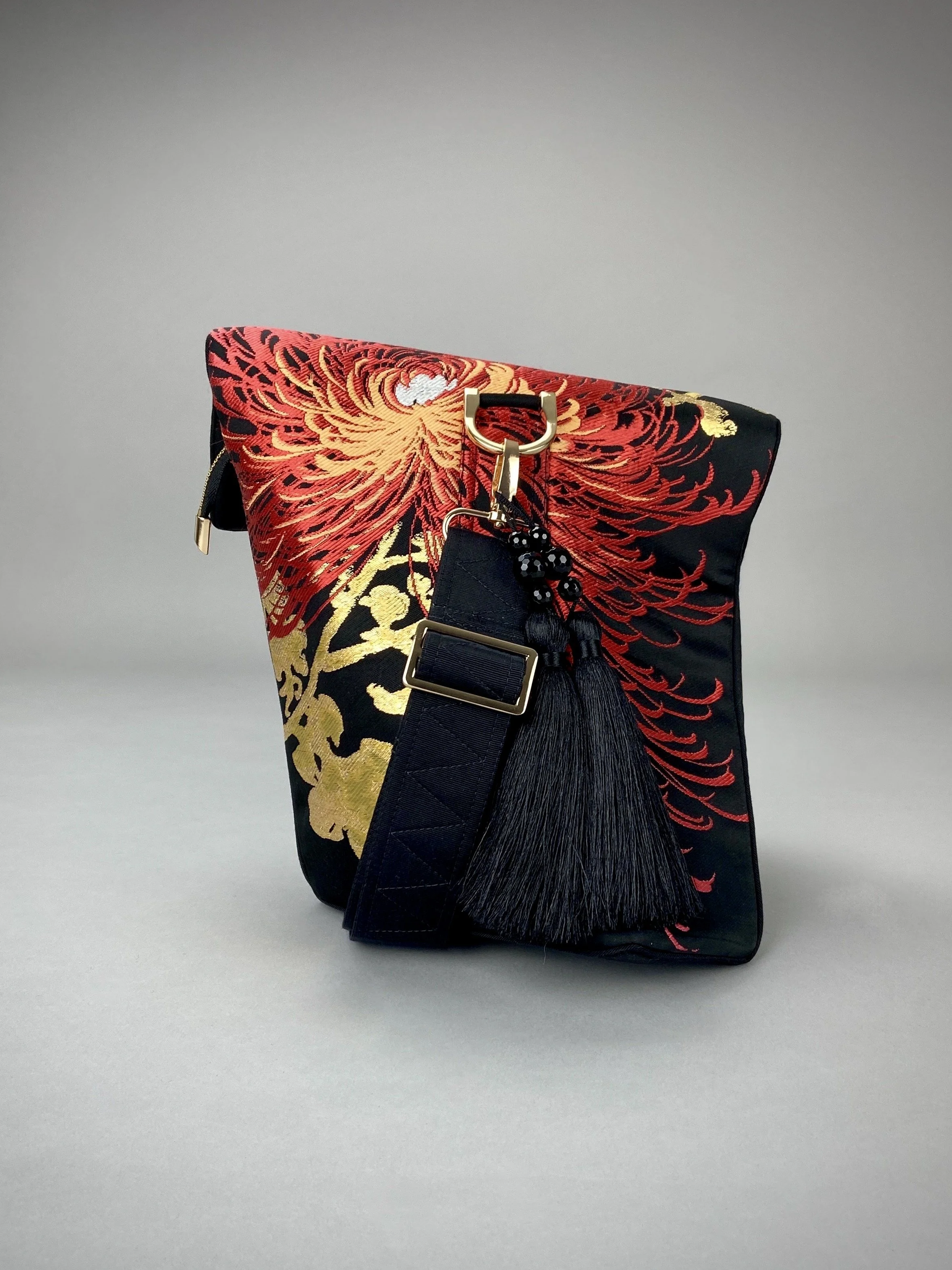 Black and crimson Chrysanthemum vintage obi silk shoulder bag with gold thread detail and black silk tassel charm by Kirsty Chivers
