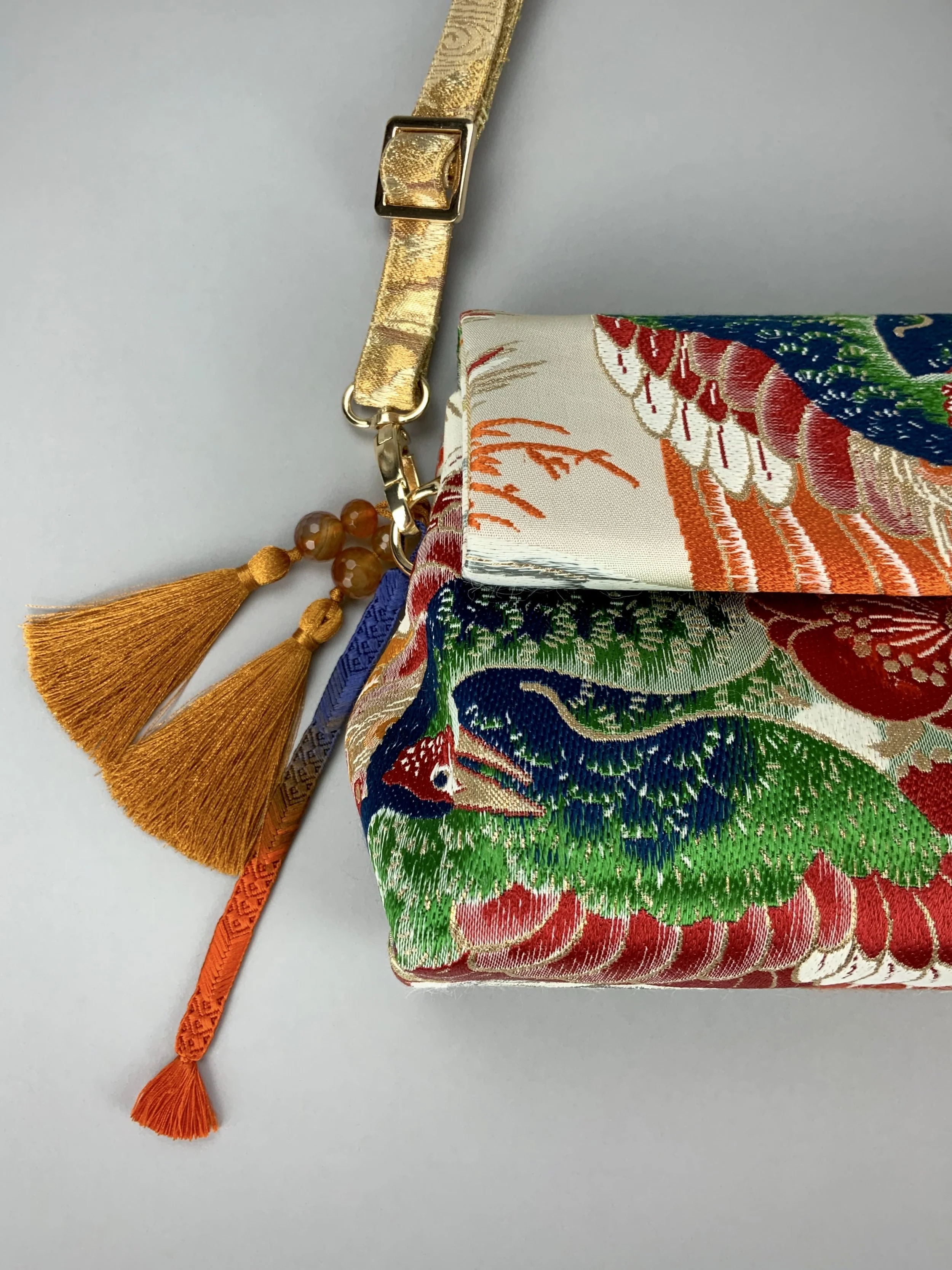 One-of-a-kind evening bag in vintage obi silk with peacock, pine motifs & gold accents