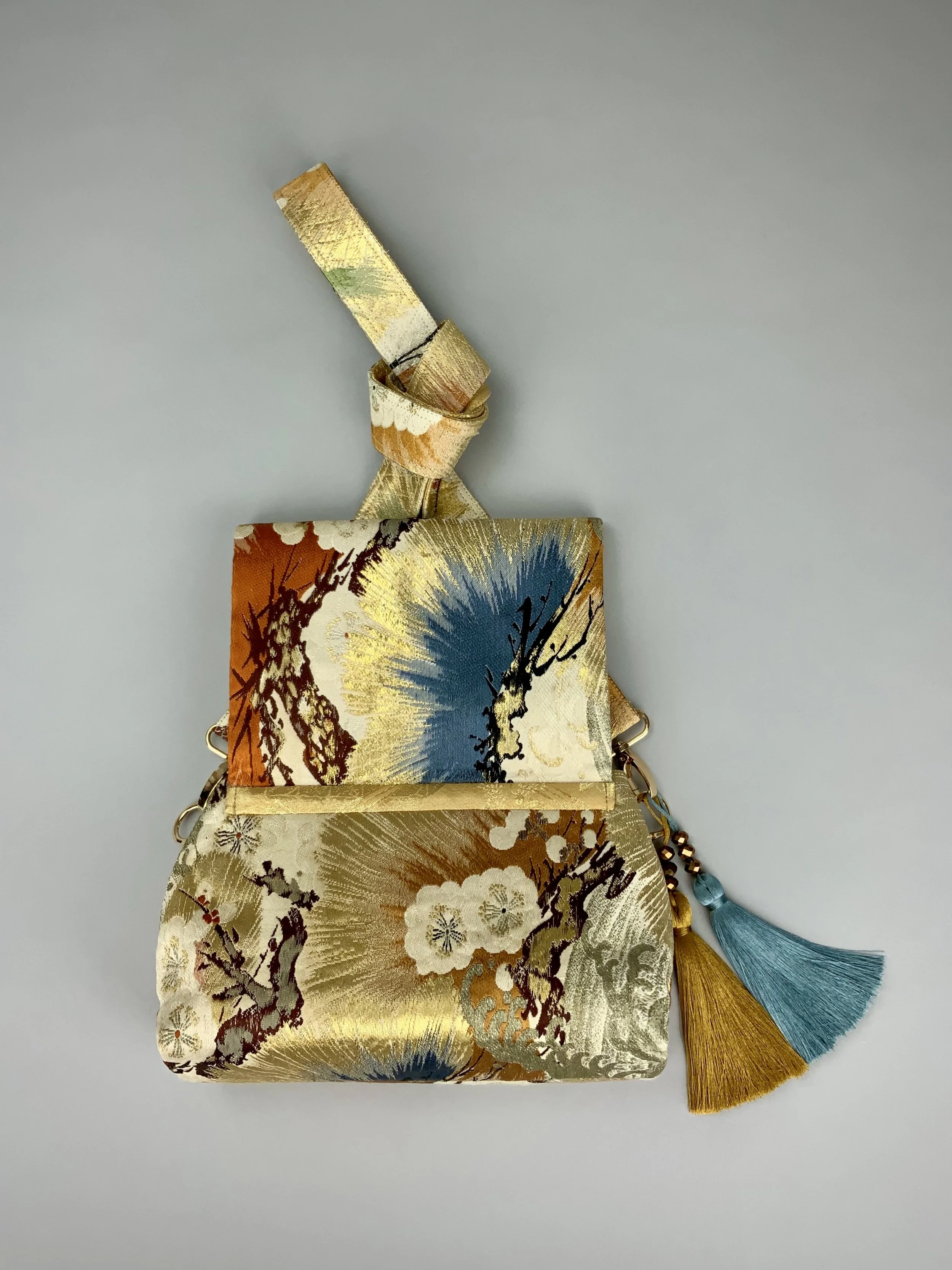Metallic gold evening bag with Matsu pine and blossom design, made from vintage obi silk by Kirsty Chivers