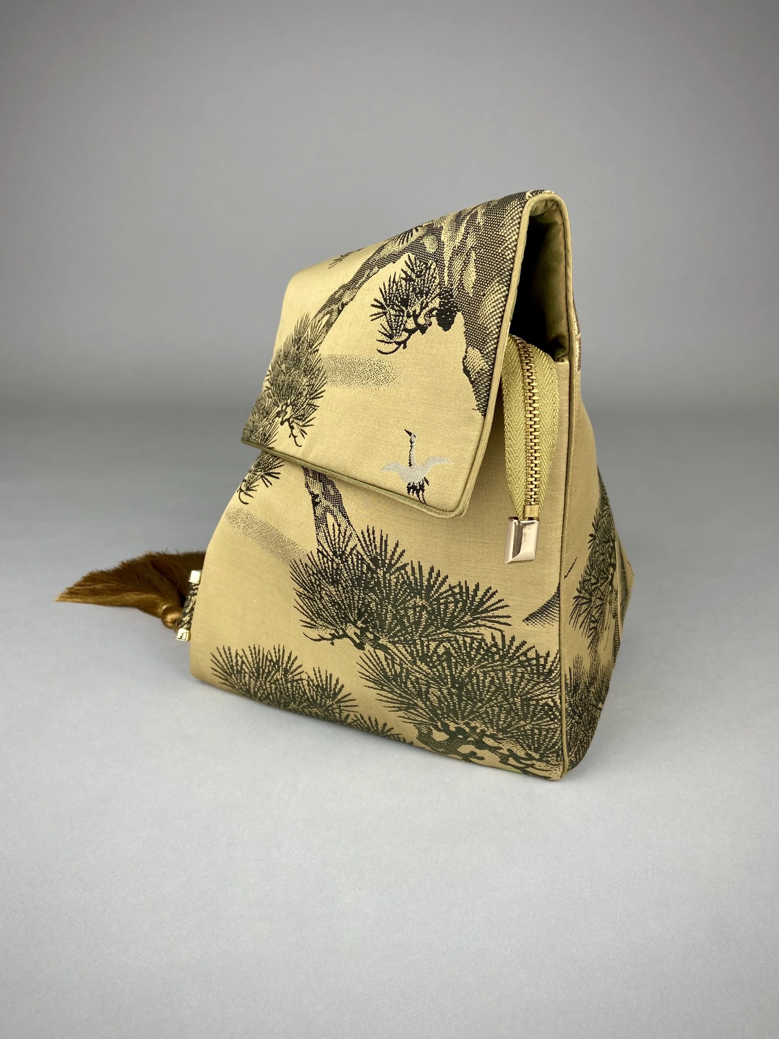 Olive green Matsu pine vintage obi silk shoulder bag with crane design, gold thread detailing and matching fabric tassel charm by Kirsty Chivers
