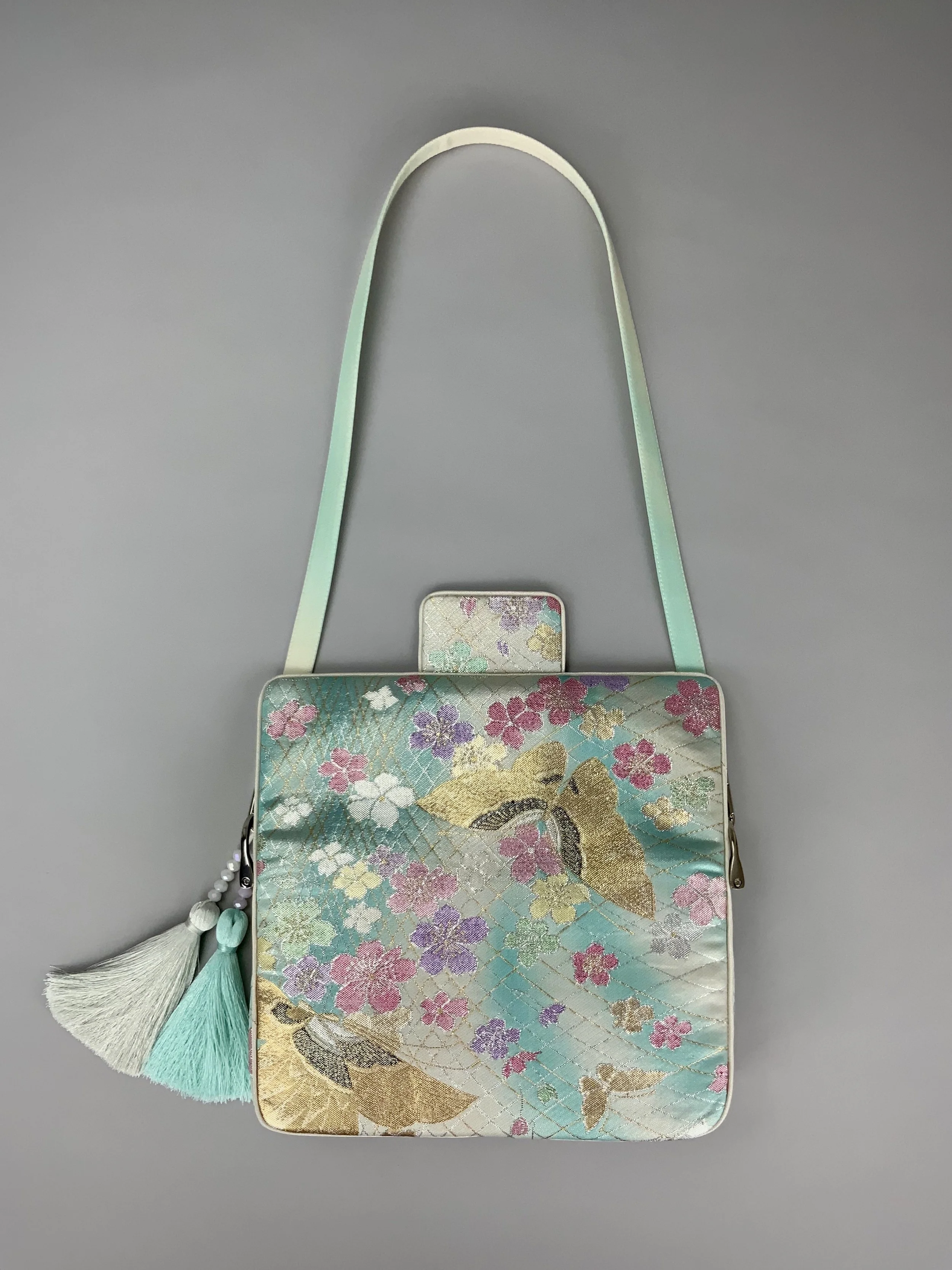 Aqua ombre evening bag made from vintage obi silk with pastel gold butterfly and blossom design by Kirsty Chivers