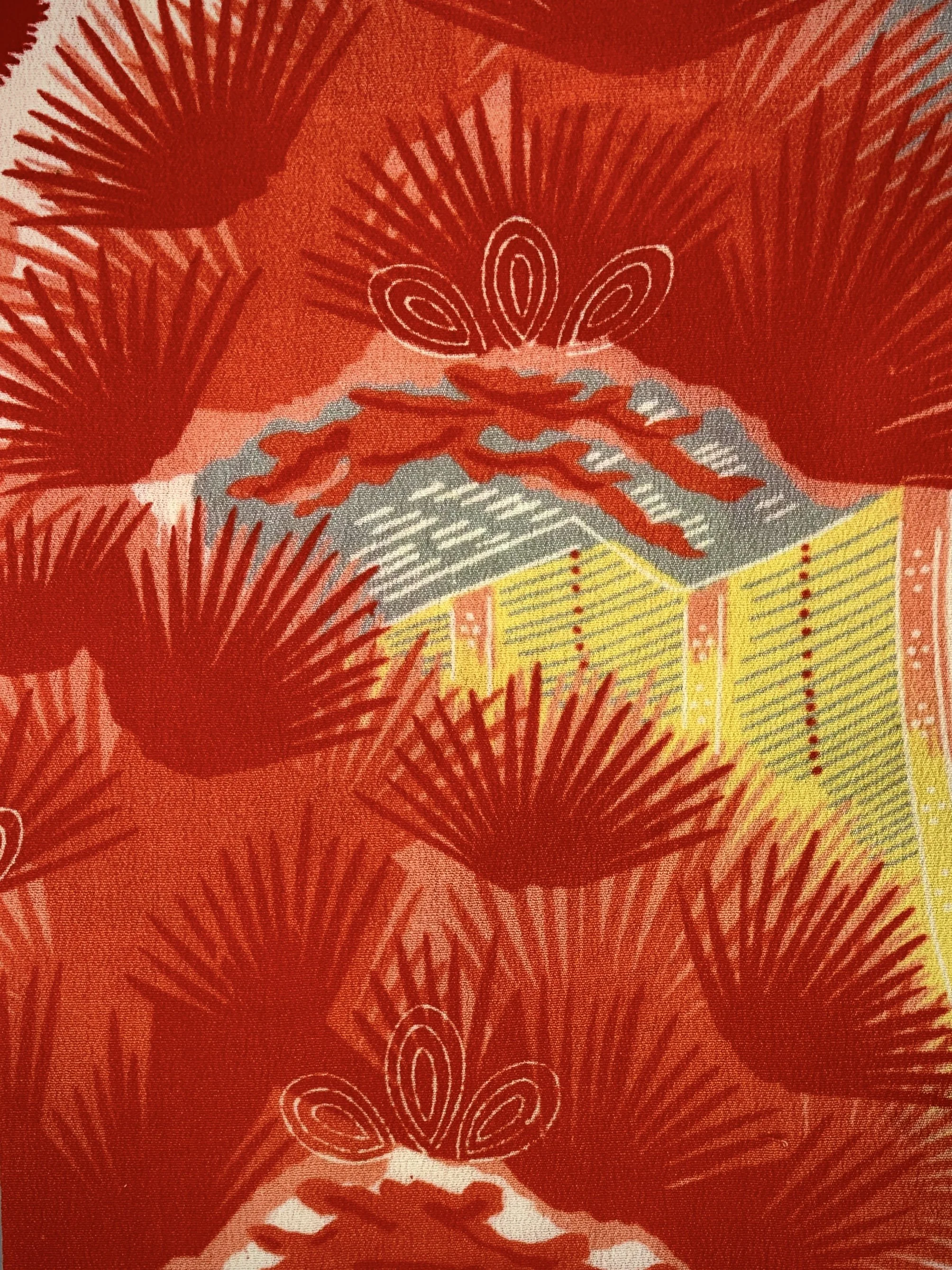 Closeup of vibrant red and yellow scarf with printed blossom design, handmade from repurposed Japanese kimono crepe silk by Kirsty Chivers