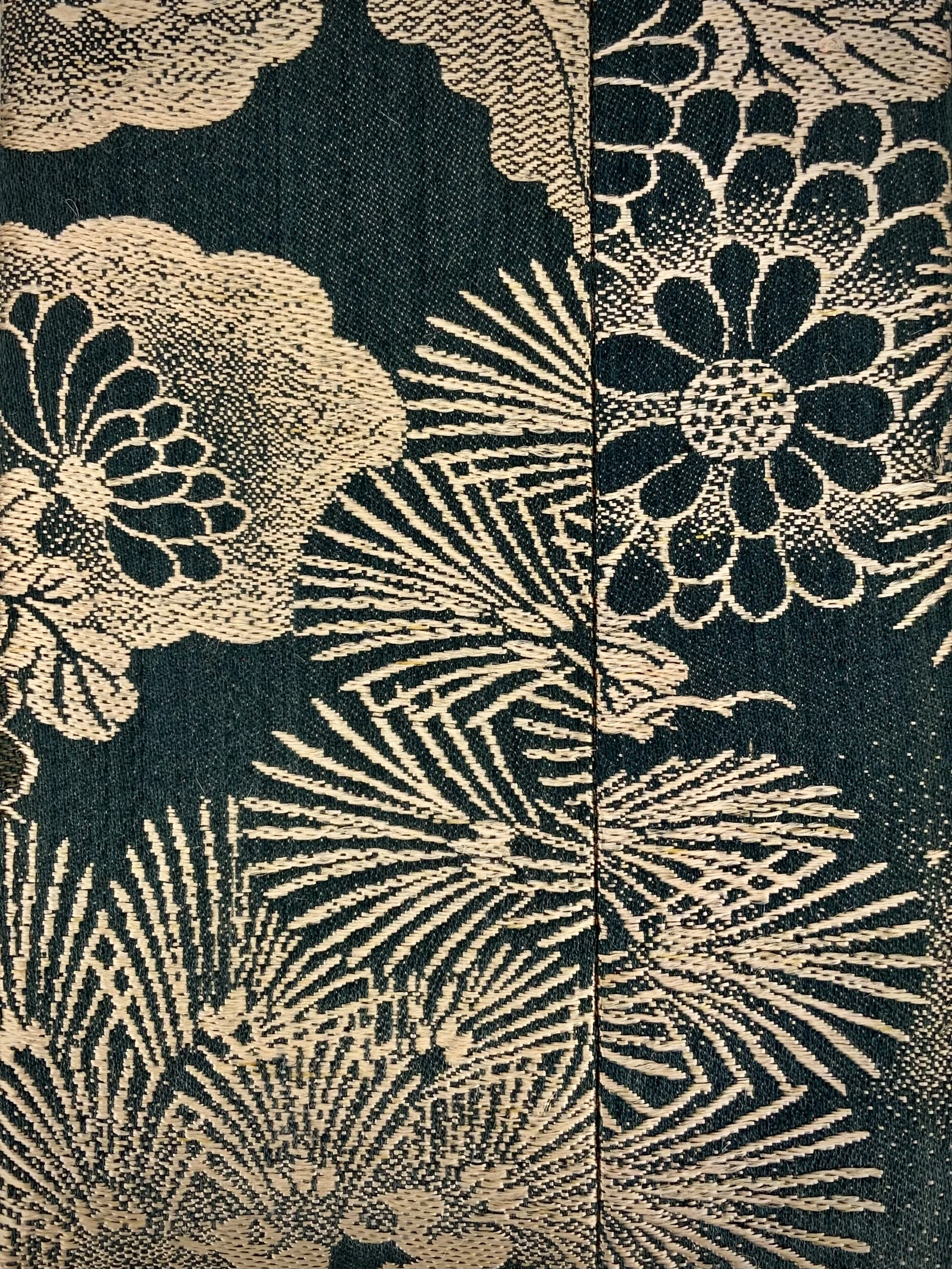 Closeup of unique evening clutch purse with tassel, made from vintage Japanese obi fabric