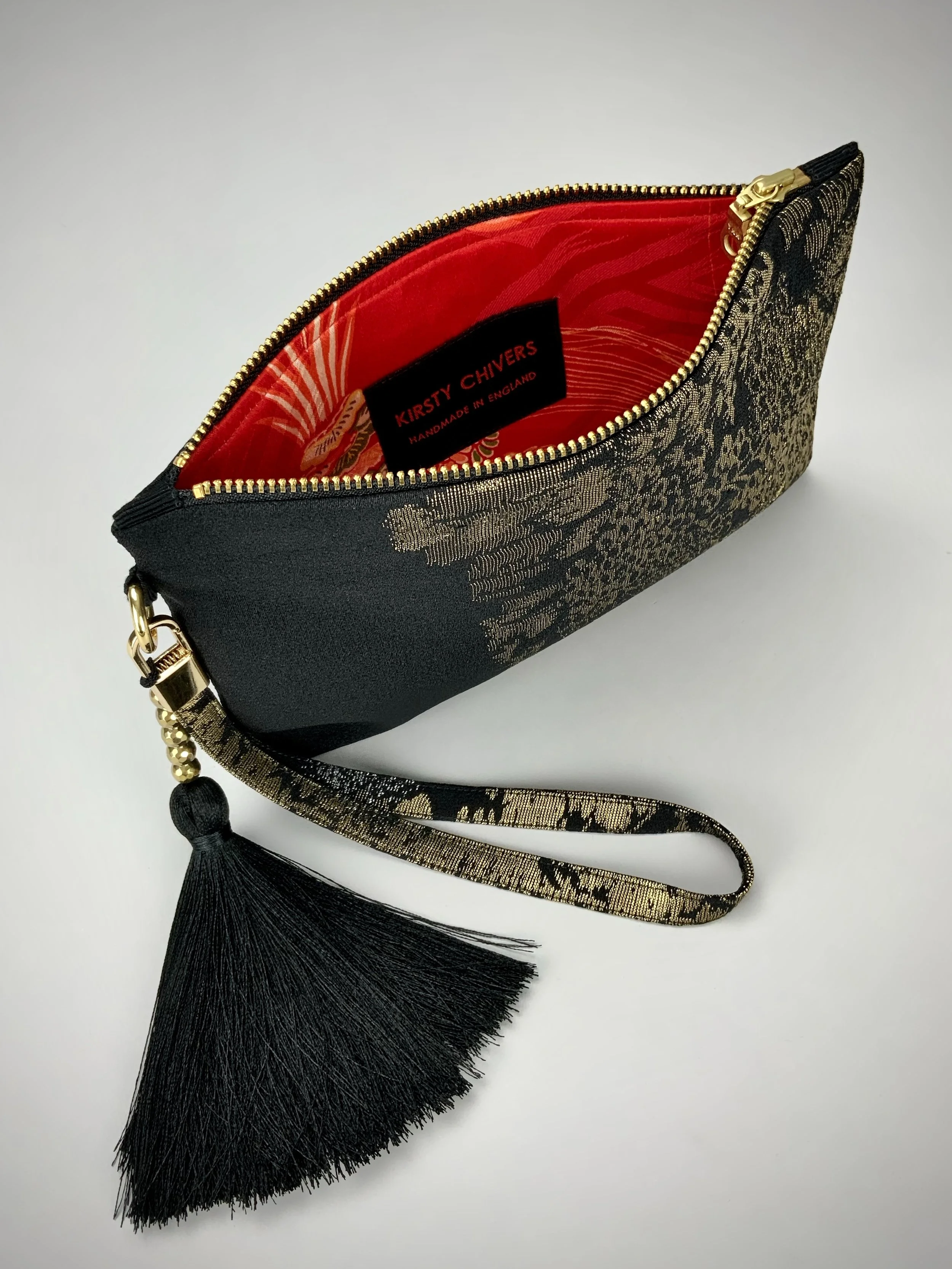 Inside view of wristlet purse made from vintage Japanese Haori silk with gold Urushi thread design