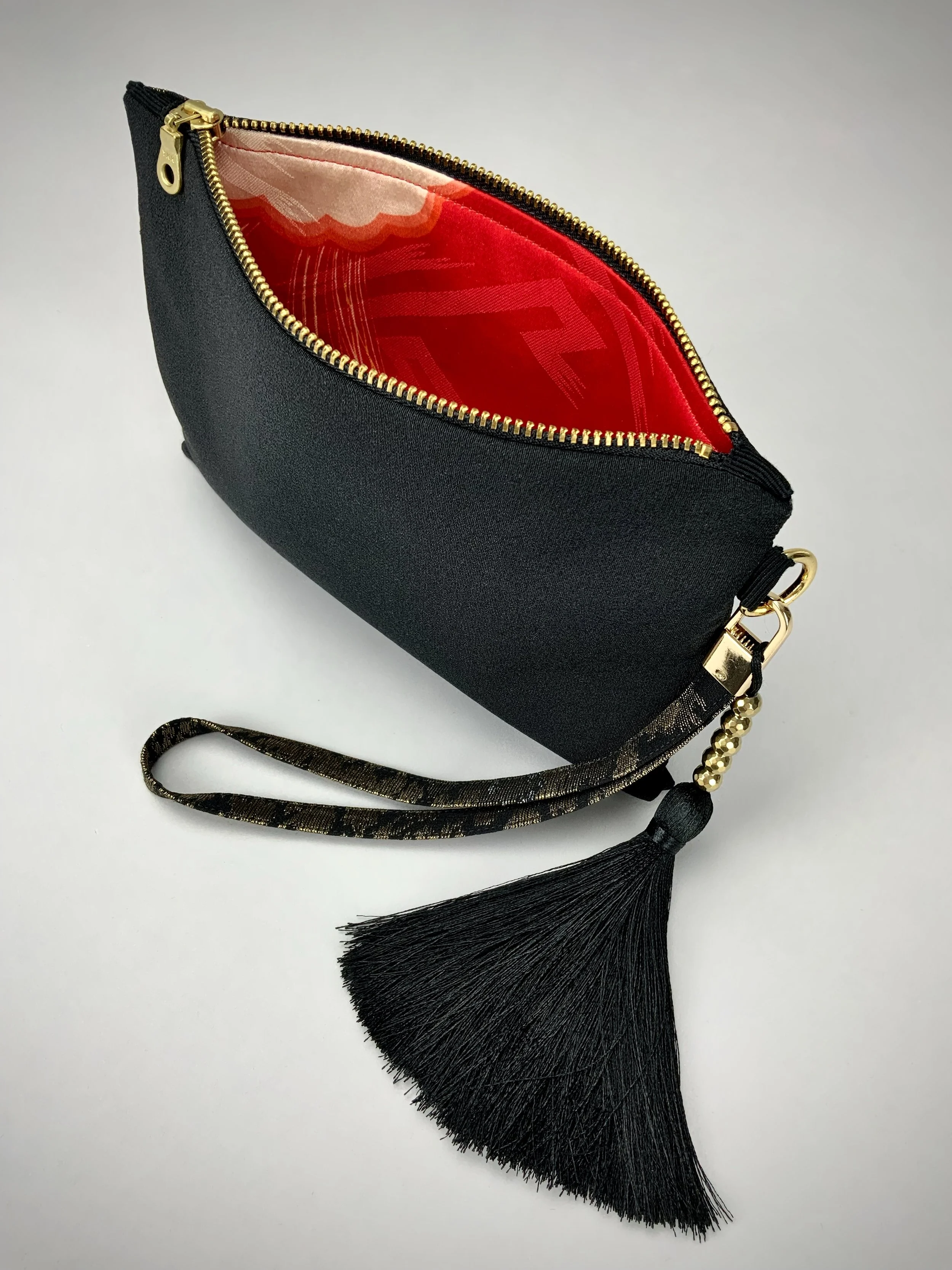 Inside view of wristlet purse made from vintage Japanese Haori silk with gold Urushi thread design