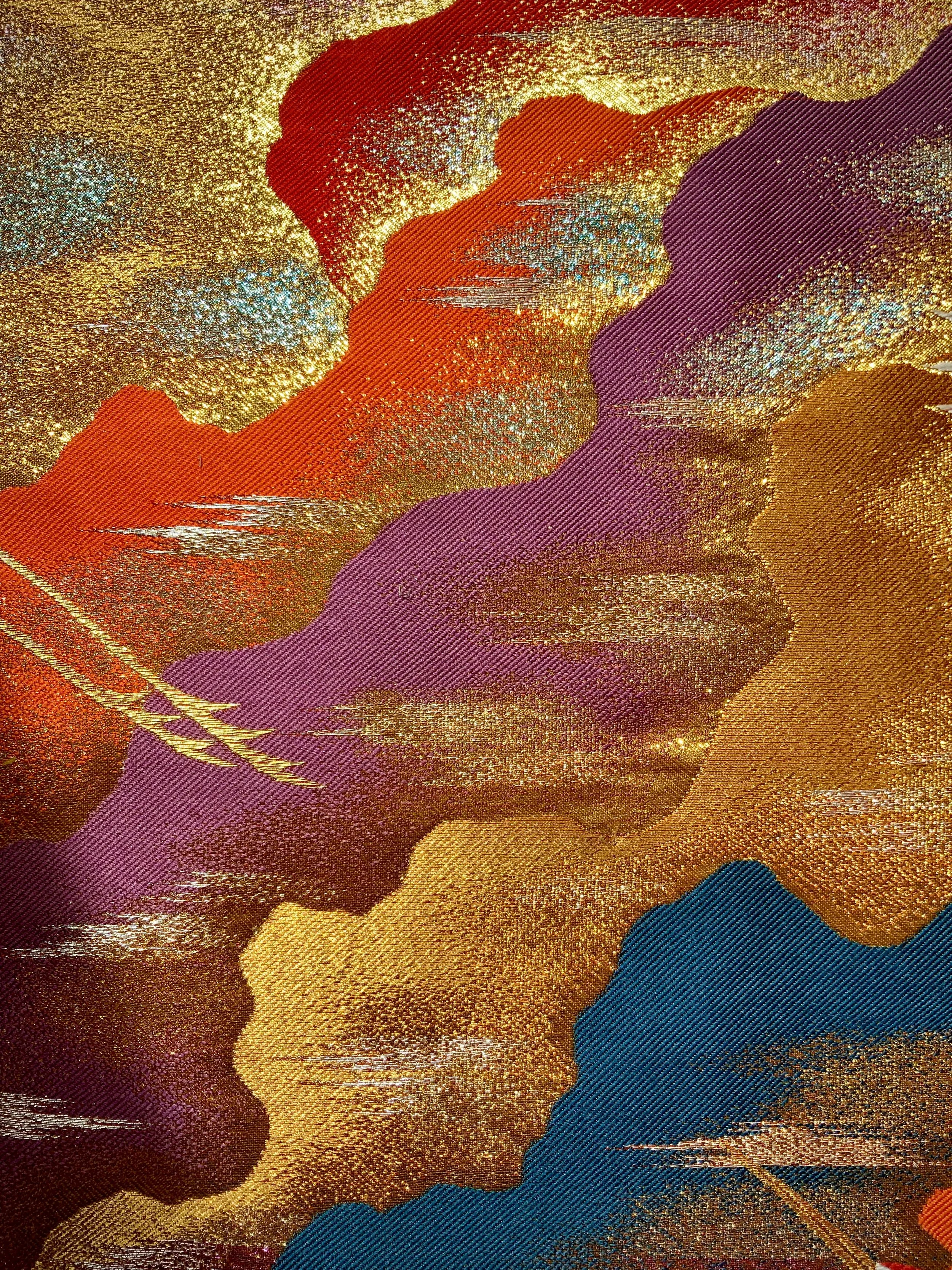 Closeup of one-of-a-kind vermillion red bomber jacket crafted from vintage Japanese kimono silk