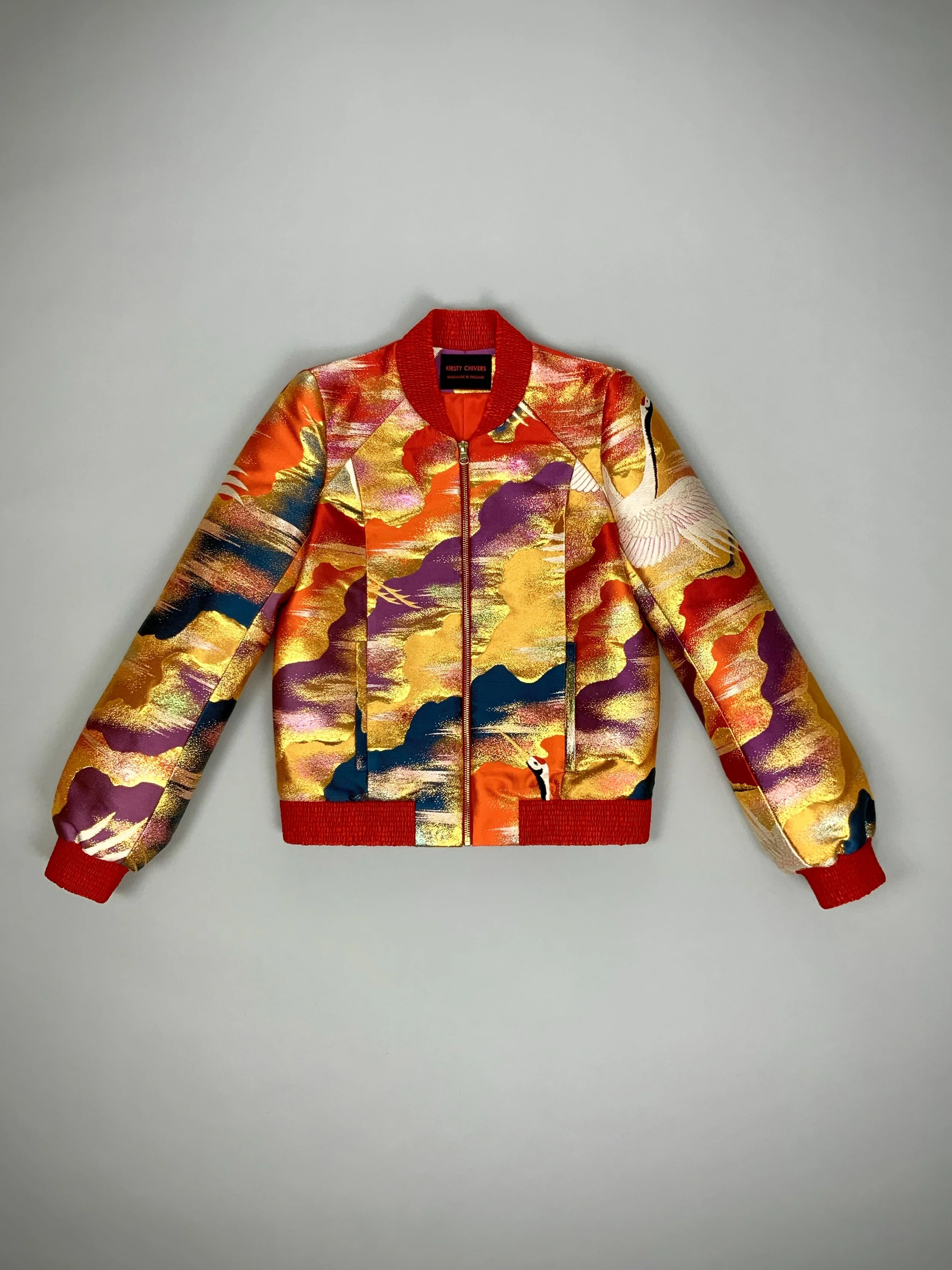 One-of-a-kind vermillion red bomber jacket crafted from vintage Japanese kimono silk