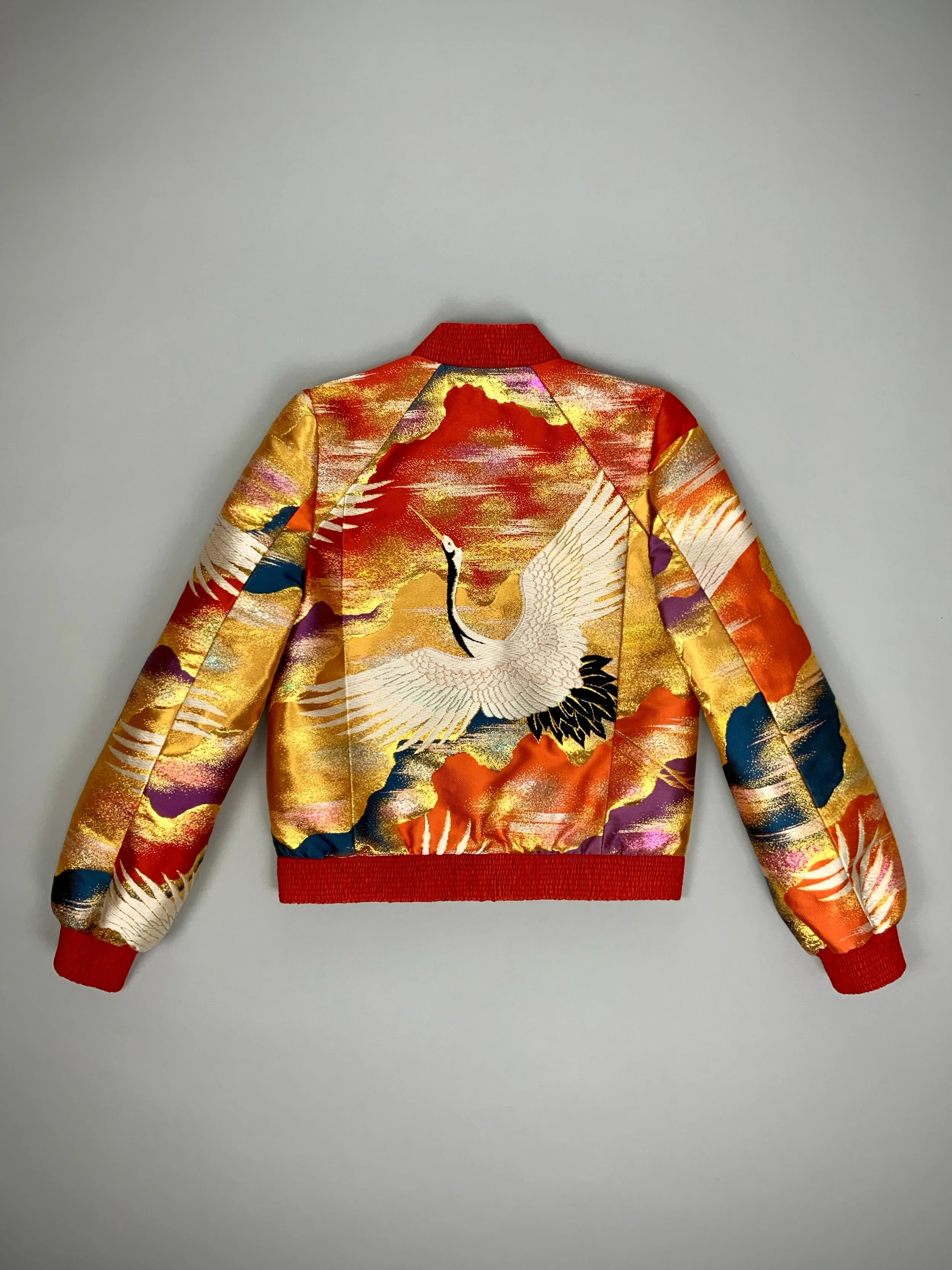 One-of-a-kind vermillion red bomber jacket crafted from vintage Japanese kimono silk