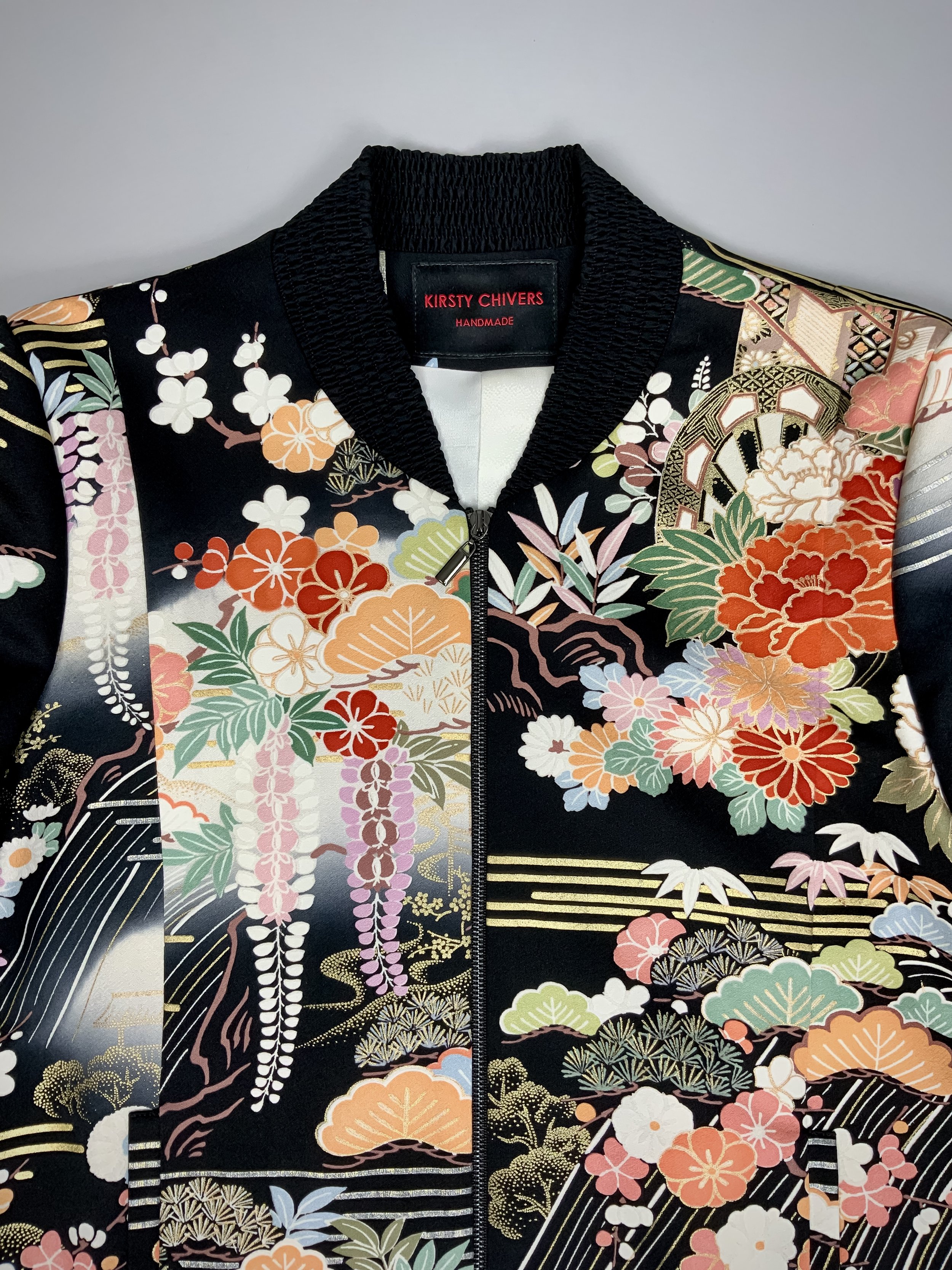 Closeup of unique black printed bomber jacket handmade using vintage Japanese Furisode kimono silk