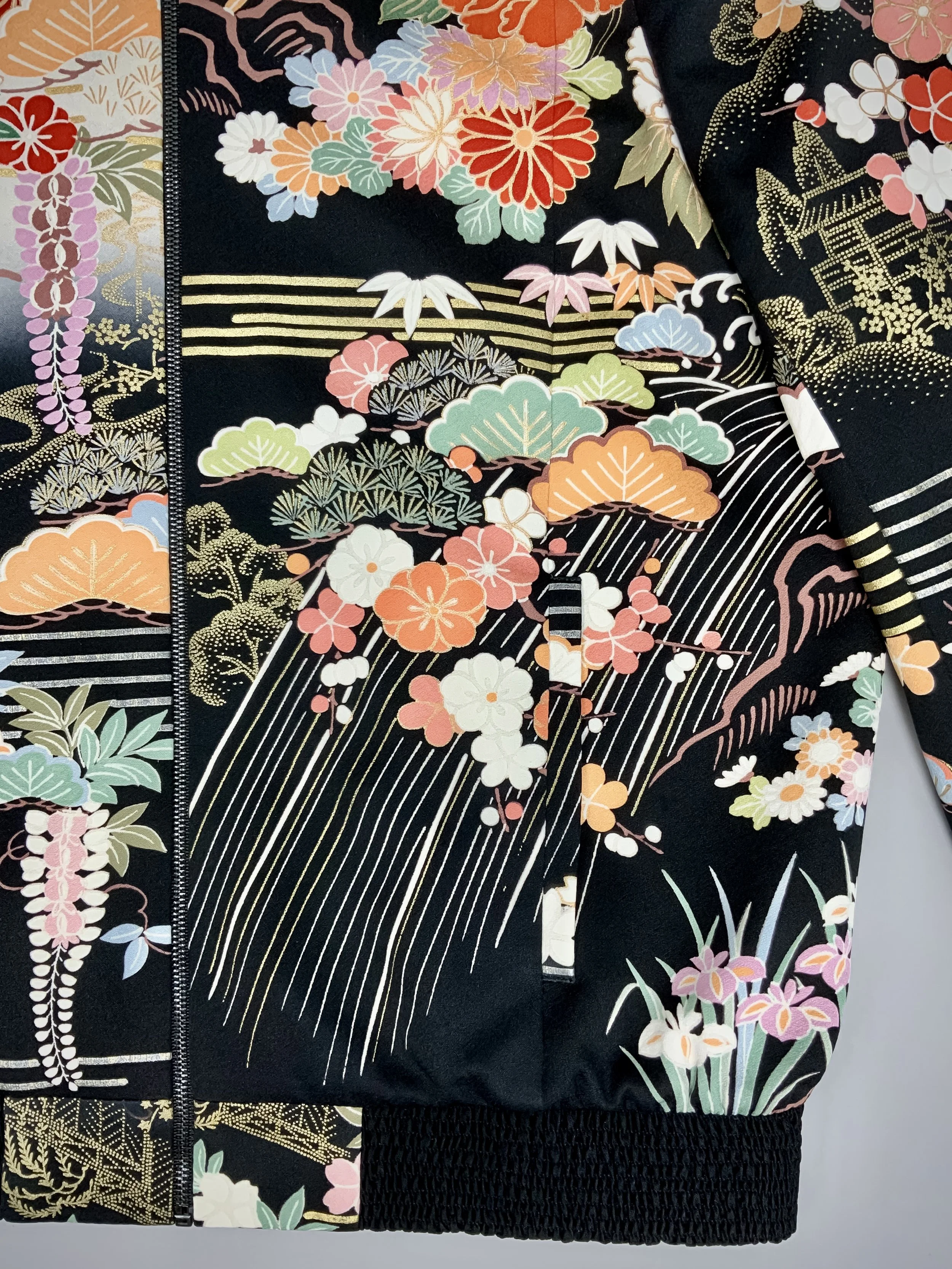 Closeup of unique black printed bomber jacket handmade using vintage Japanese Furisode kimono silk
