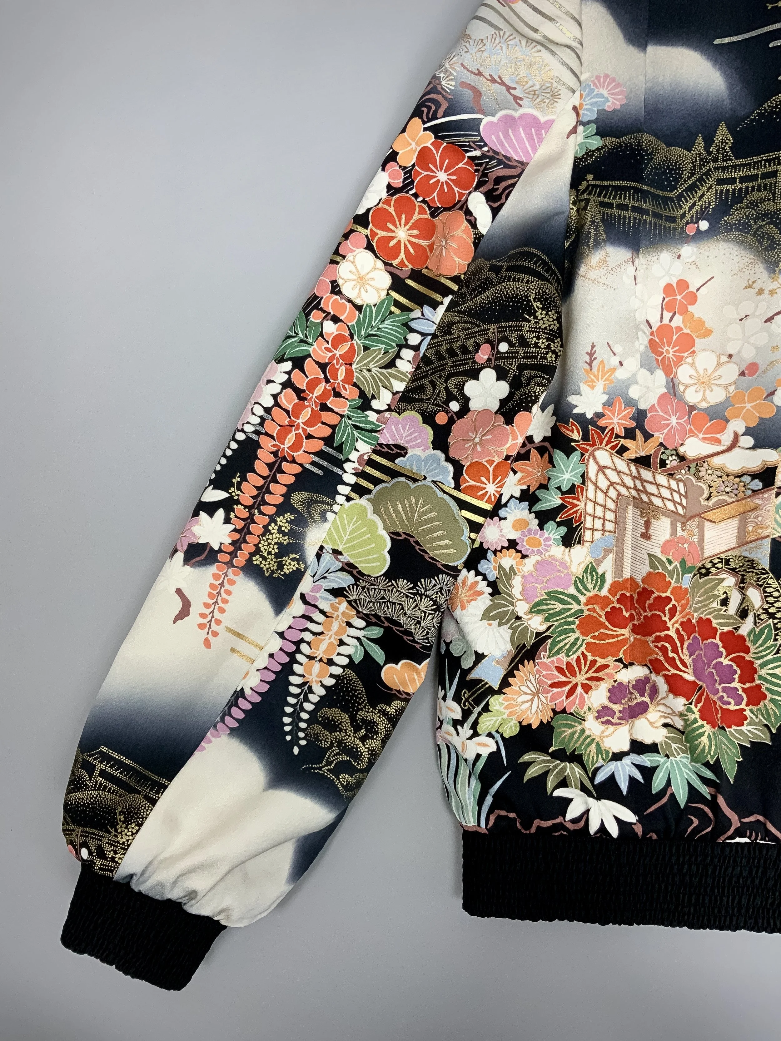 Closeup of unique black printed bomber jacket handmade using vintage Japanese Furisode kimono silk