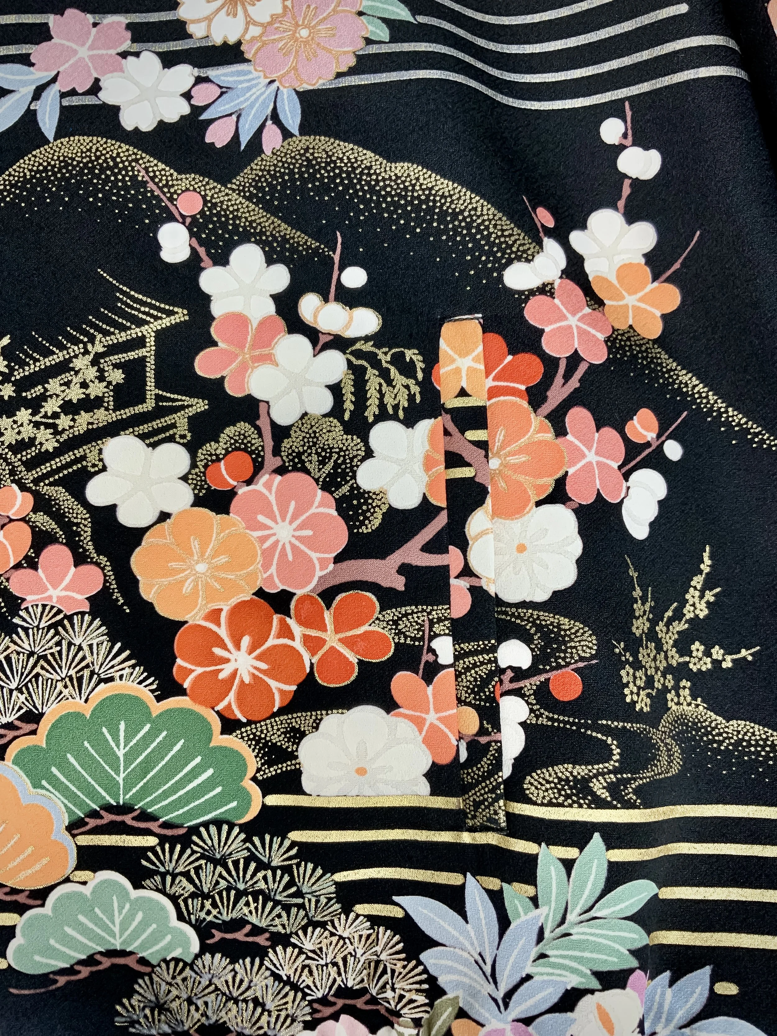 Closeup of unique bomber jacket with printed design, handmade with vintage Japanese Furisode kimono silk