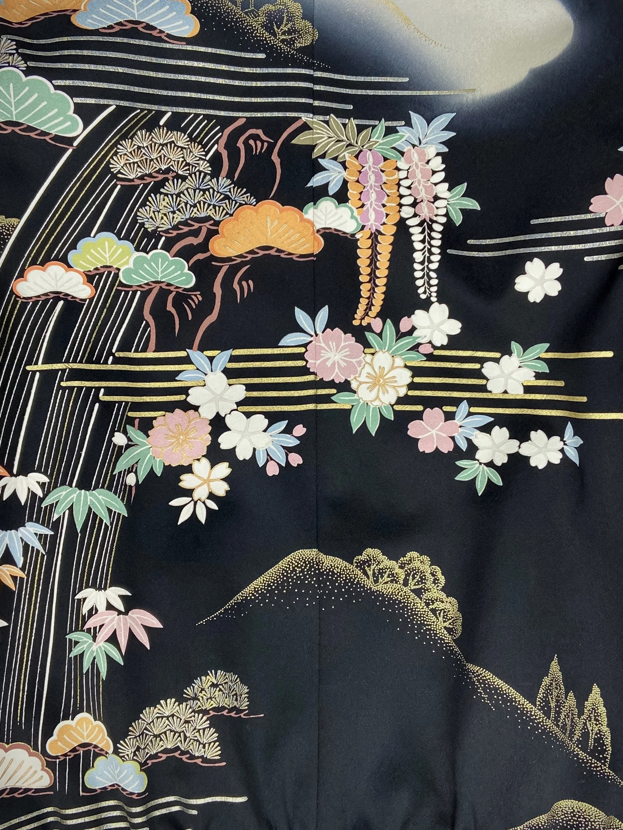 Closeup of unique bomber jacket with printed design, handmade with vintage Japanese Furisode kimono silk