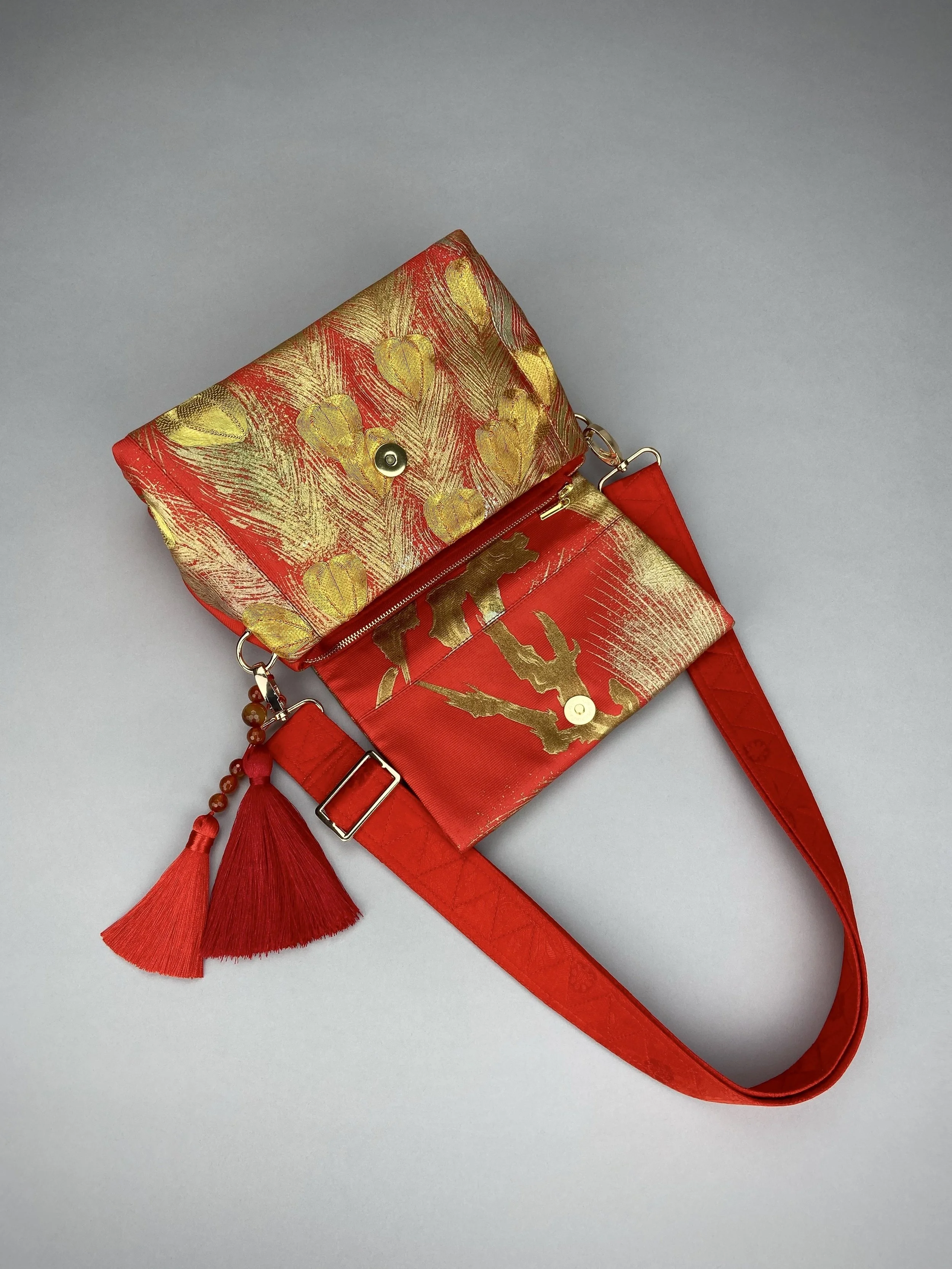 Vermillion red vintage kimono silk evening bag with gold Peacock feather design by Kirsty Chivers