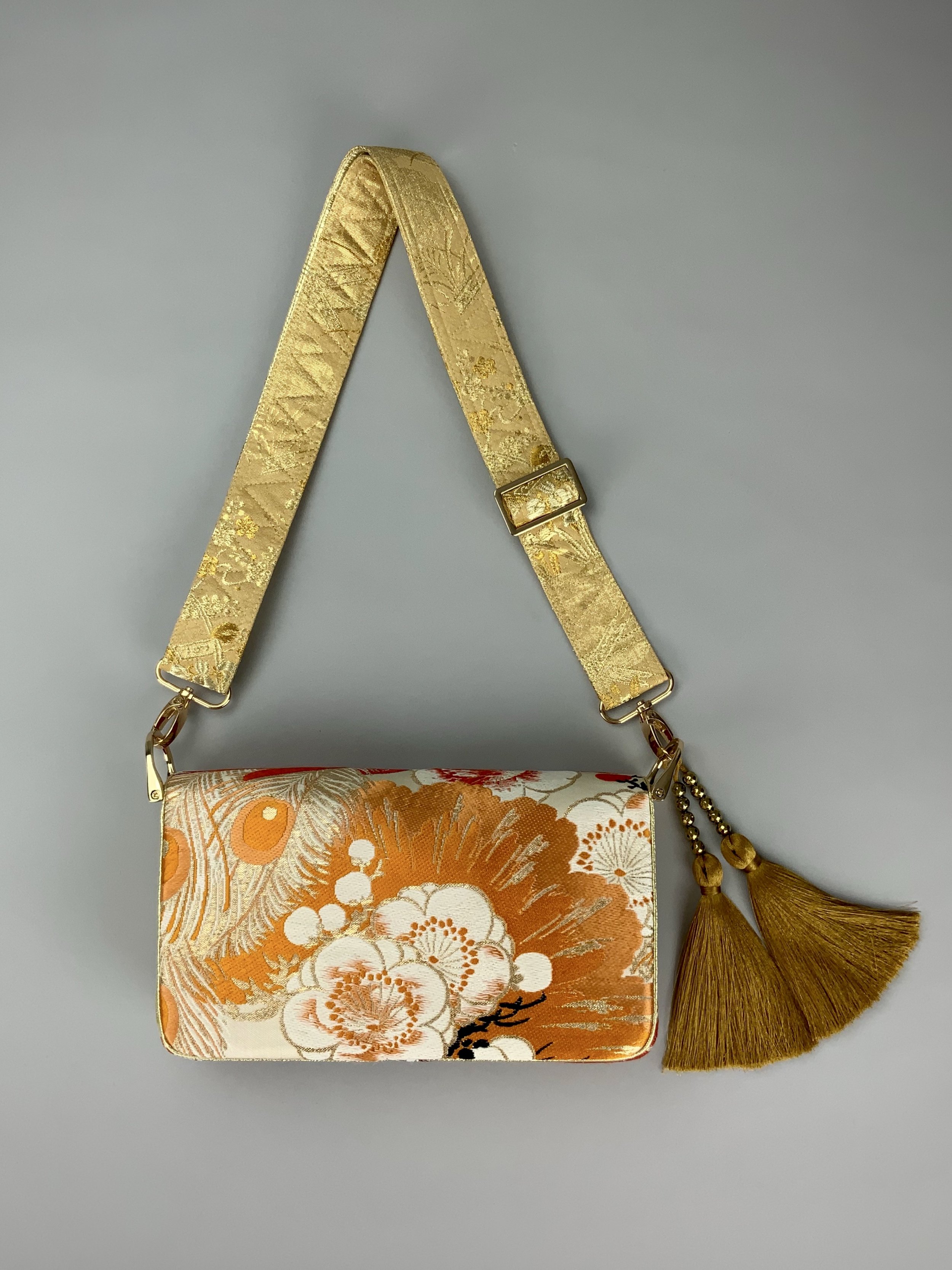 Unique evening bag in vintage obi silk with peacock, pine motifs & gold accents by Kirsty Chivers