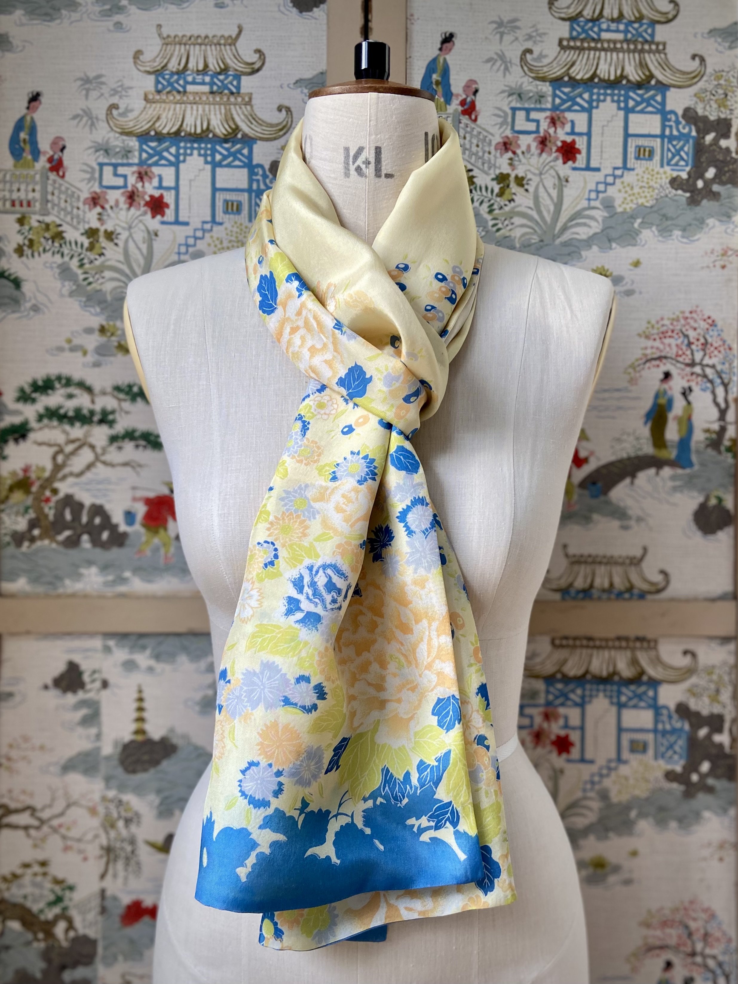 Yellow scarf with blossom print, presented on a dress stand, handmade from vintage kimono fabric and silk satin by Kirsty Chivers
