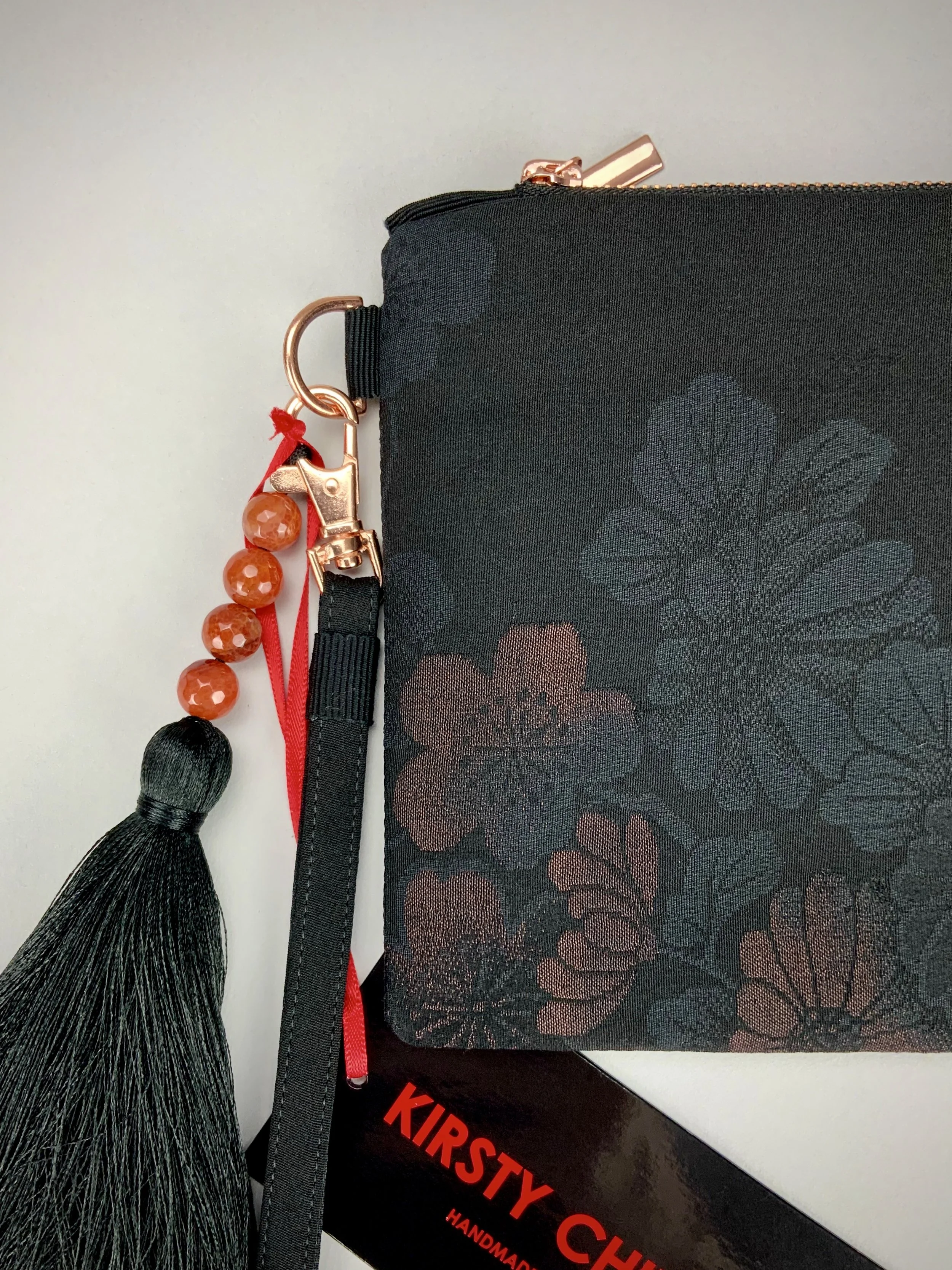 Black silk wristlet purse with blossom flower design & silk tassel, made from vintage Japanese kimono fabric by Kirsty Chivers