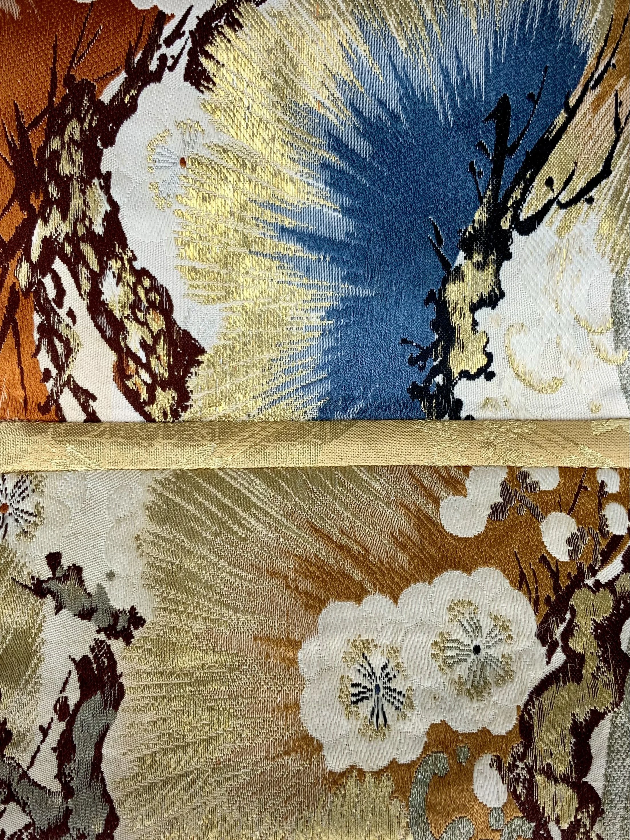 Closeup of metallic gold evening bag with Matsu pine and blossom design, made from vintage obi silk by Kirsty Chivers