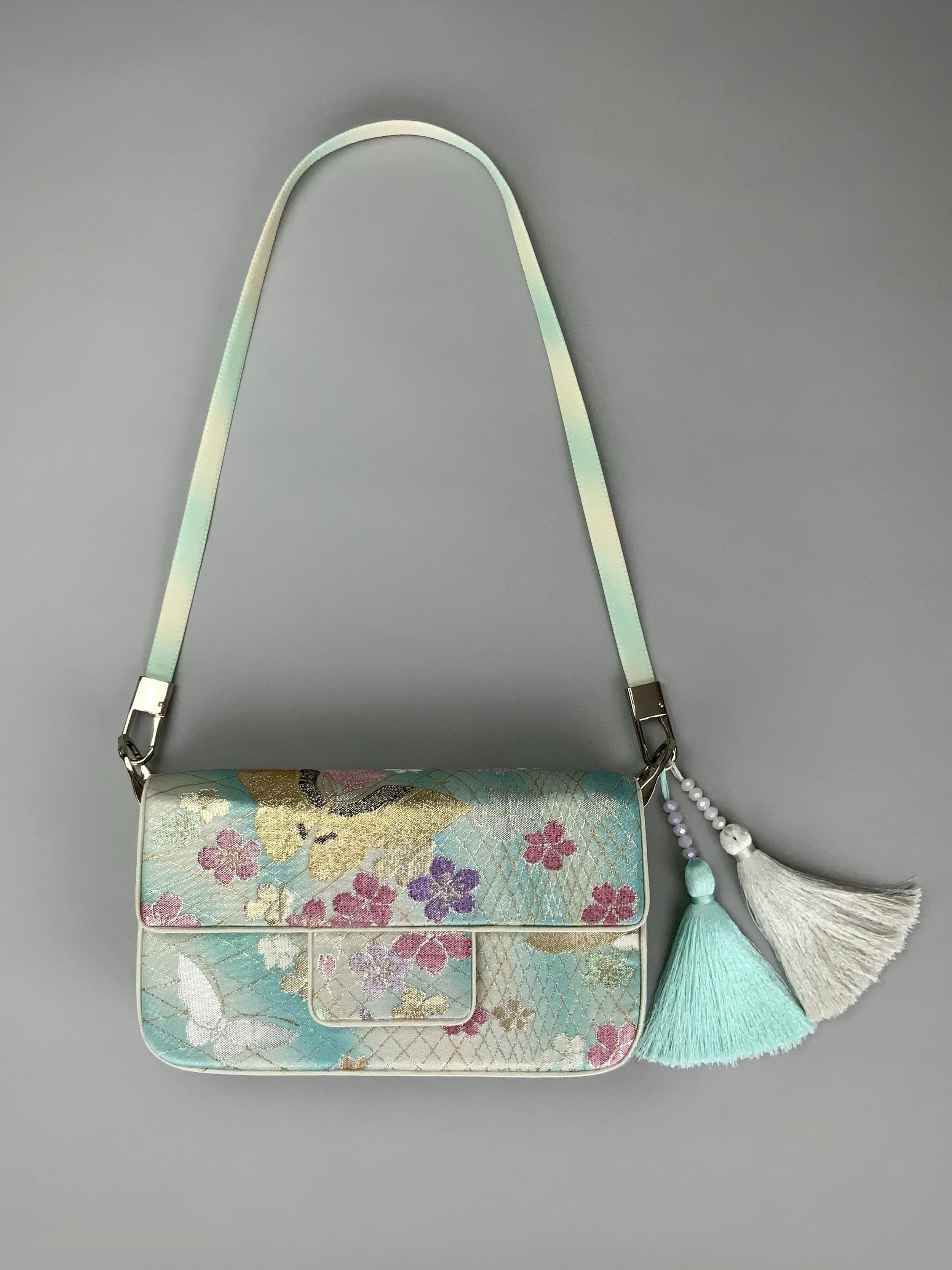 Aqua blue ombre evening bag made from vintage obi silk with pastel gold butterfly and blossom design by Kirsty Chivers