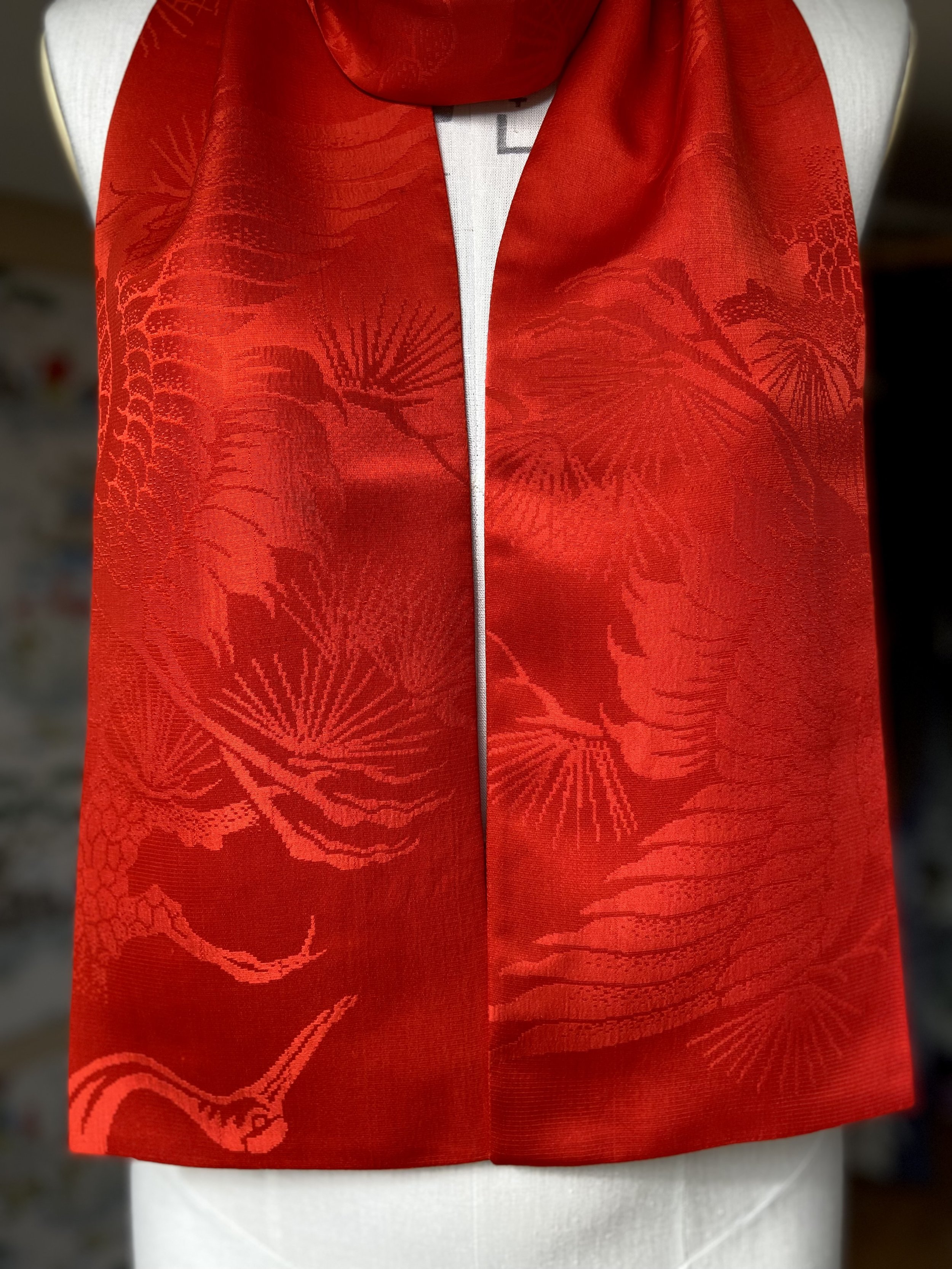Vibrant vermillion red silk scarf crafted from kimono silk by Kirsty Chivers Handmade, displayed on a dress stand
