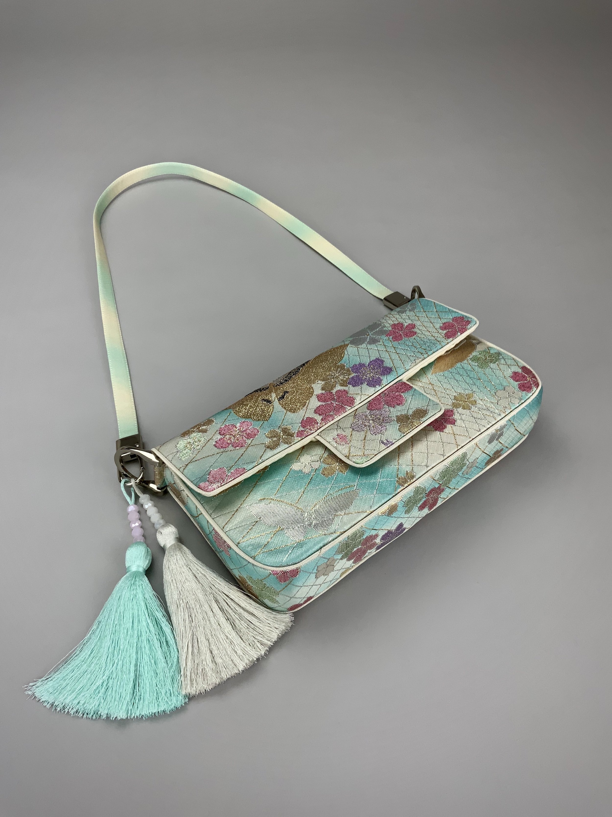 Aqua blue ombre evening bag made from vintage obi silk with pastel gold butterfly and blossom design by Kirsty Chivers