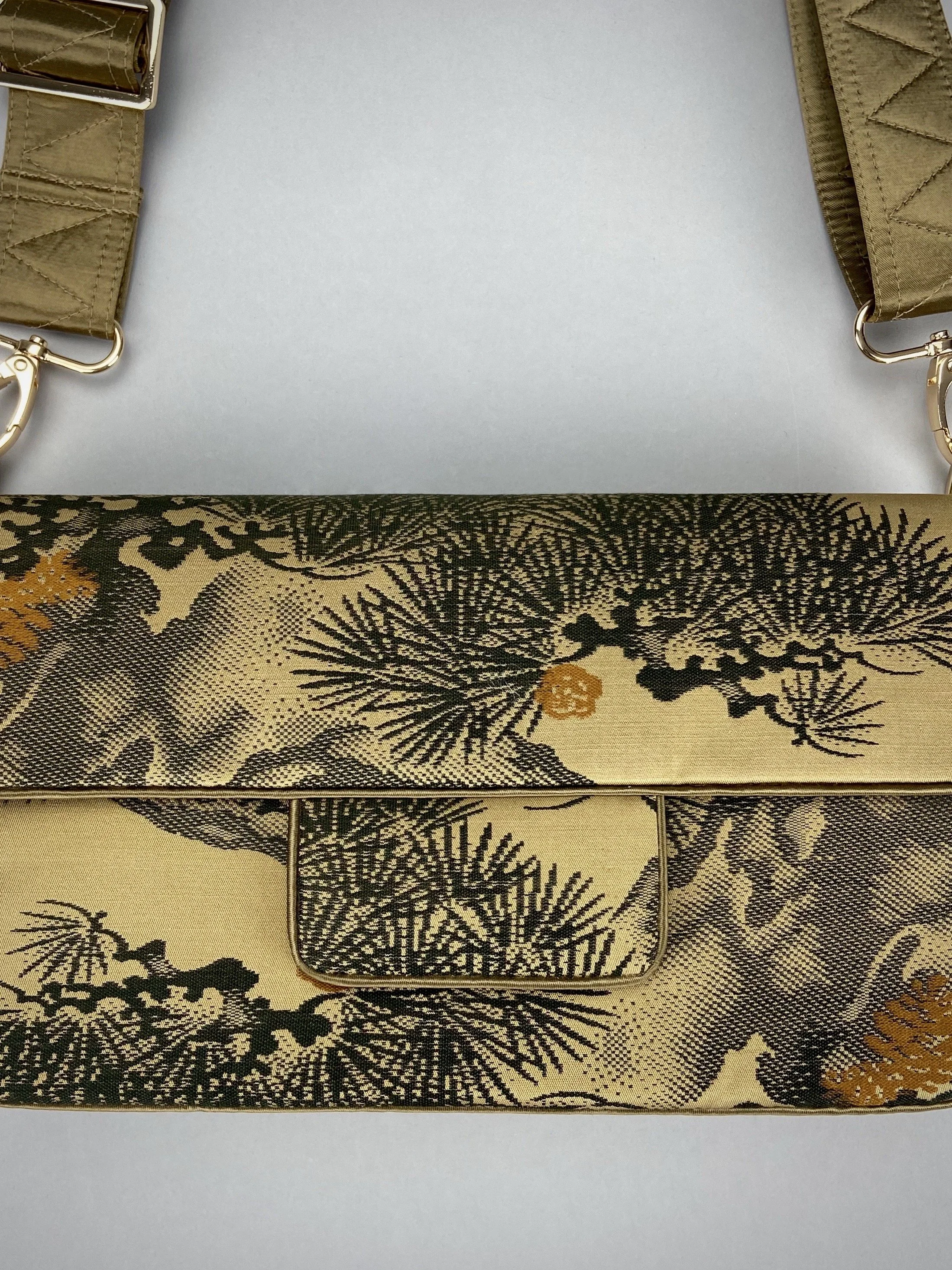 Unique Matsu pine baguette bag, made from vintage Japanese obi silk, with crane design, gold hardware and matching tassel charms by Kirsty Chivers