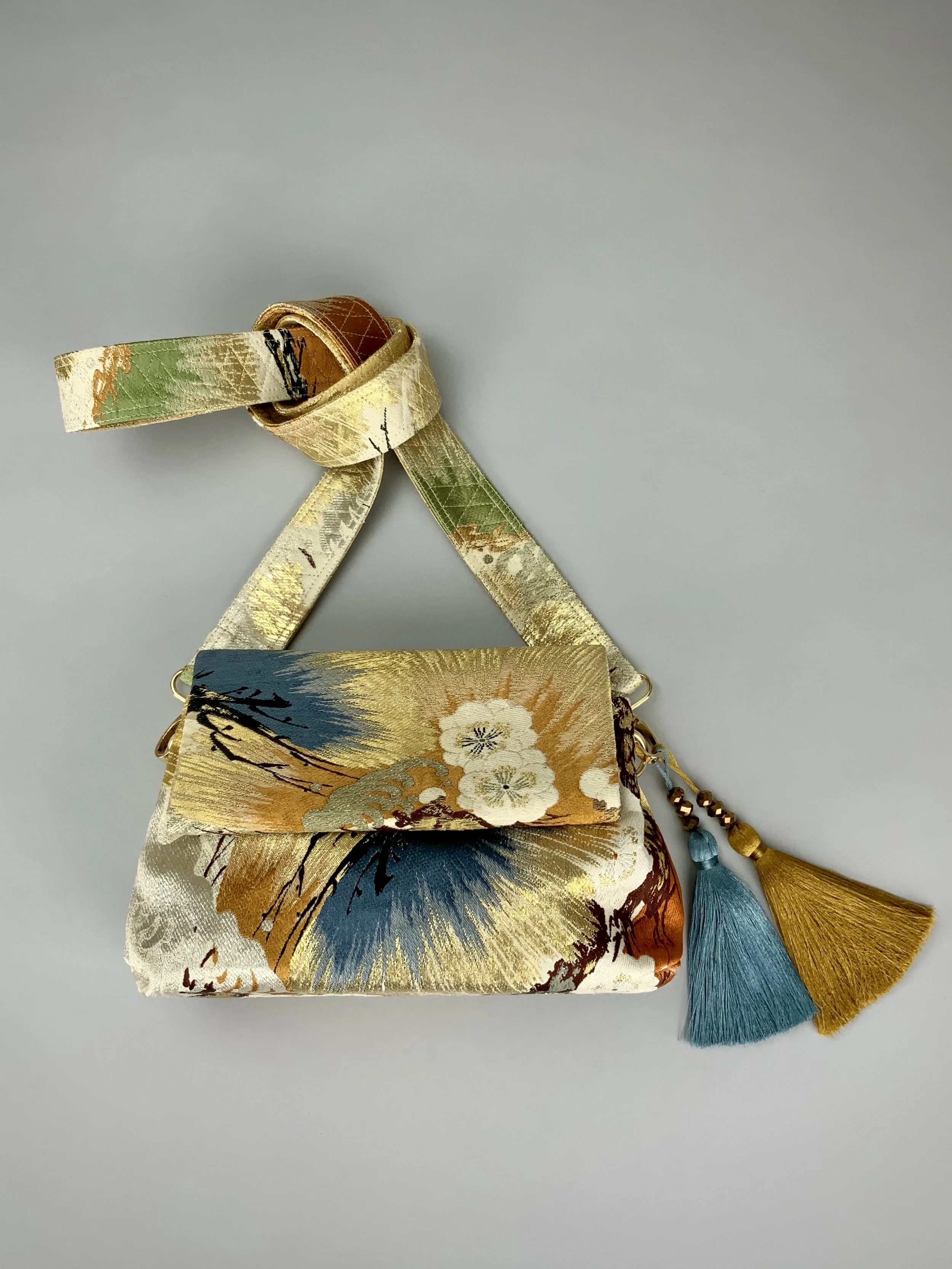 Metallic gold evening bag with Matsu pine and blossom design, made from vintage obi silk by Kirsty Chivers