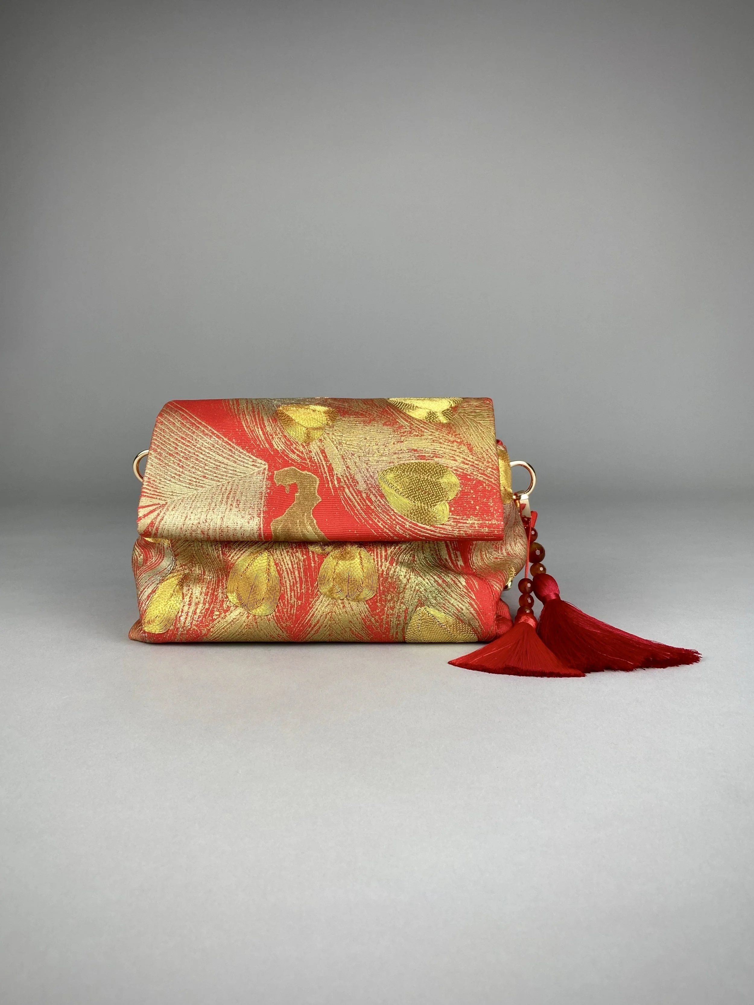 Vermillion red vintage kimono silk evening bag with gold Peacock feather design by Kirsty Chivers