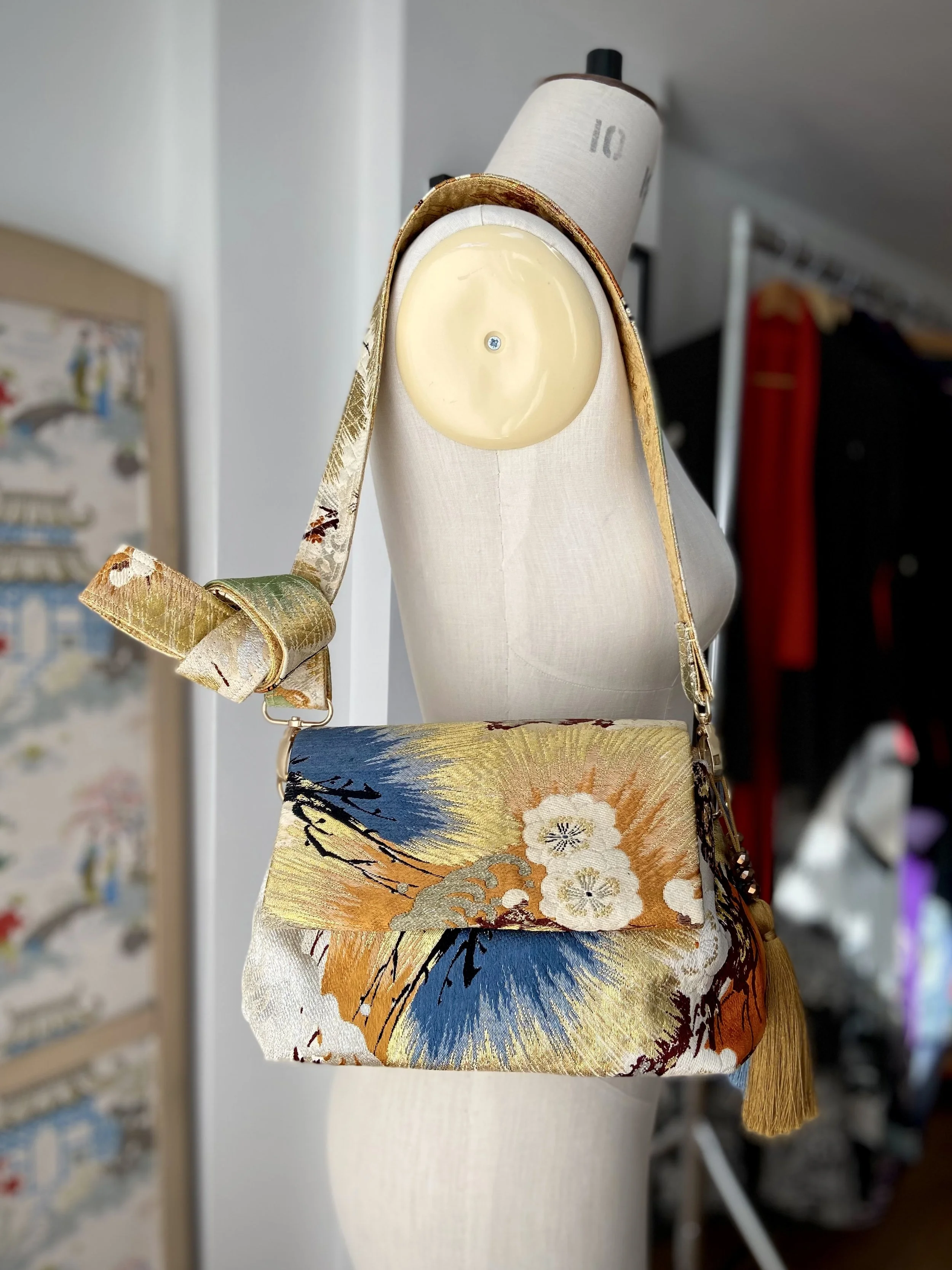 Metallic gold evening bag with Matsu pine and blossom design, made from vintage obi silk by Kirsty Chivers