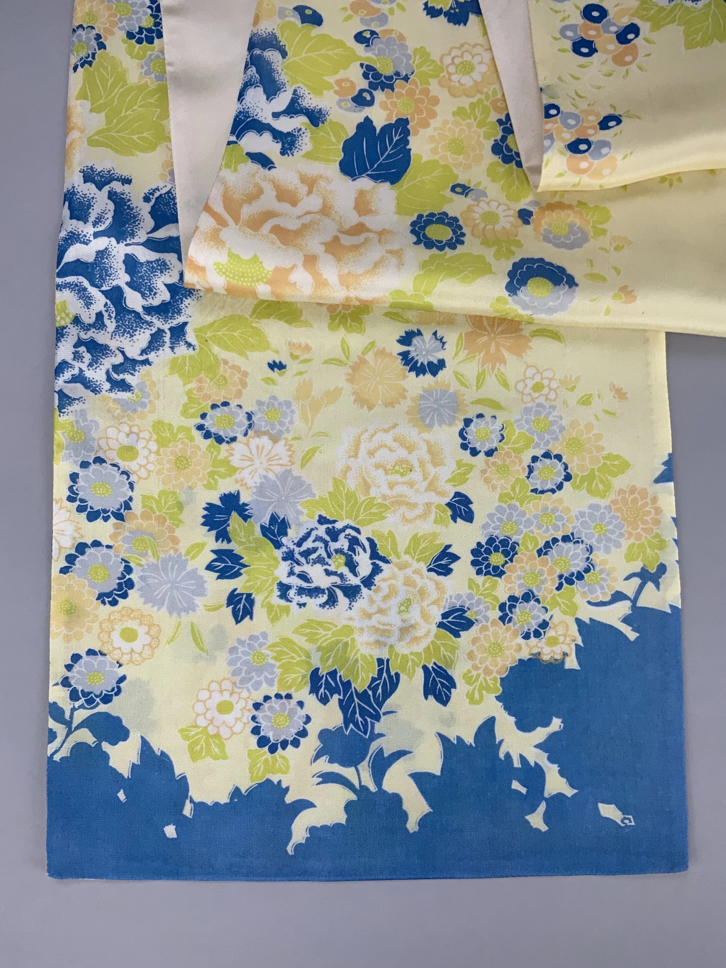 Closeup of yellow scarf with blossom print handmade from kimono fabric and silk satin by Kirsty Chivers