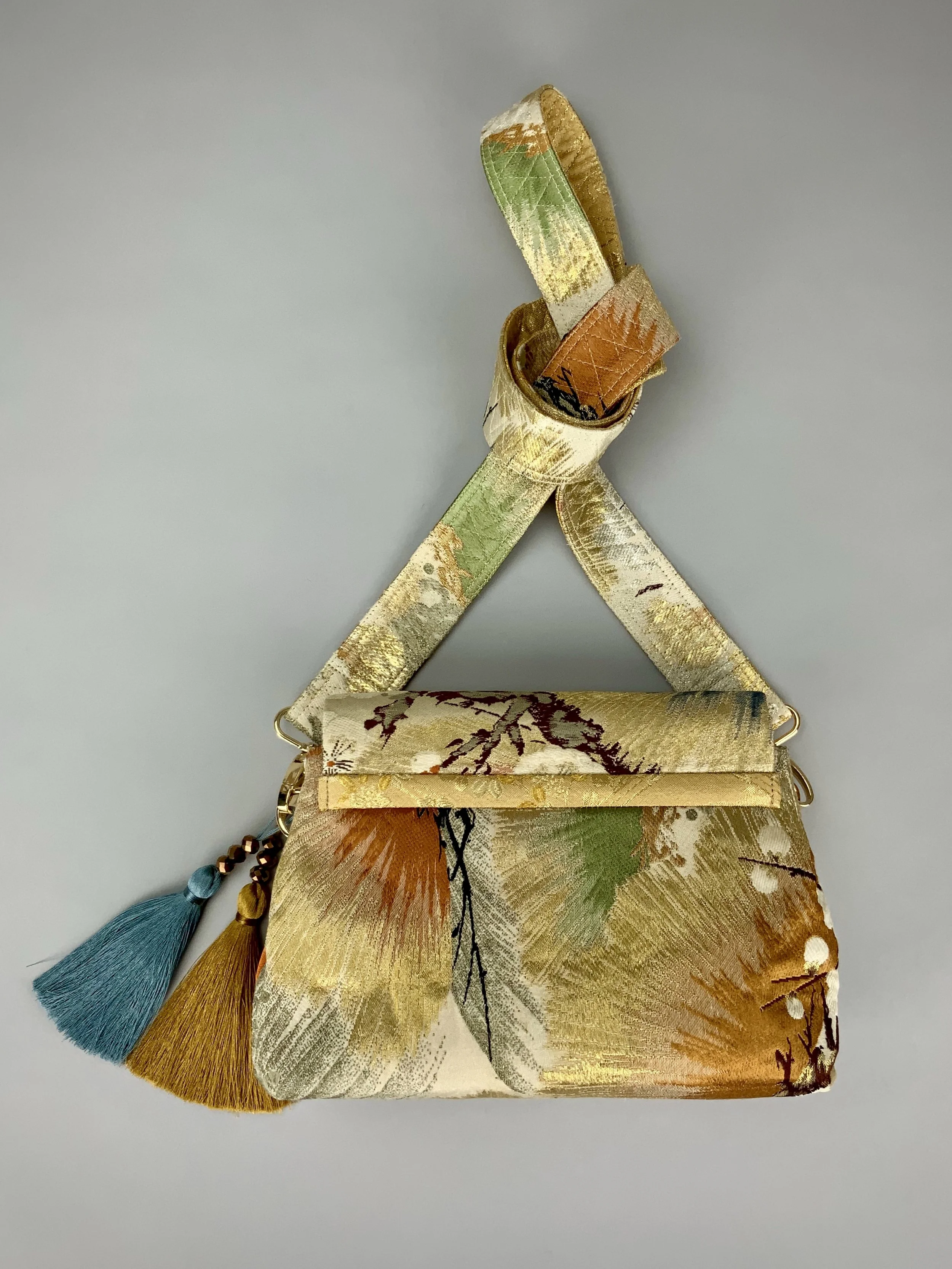 Metallic gold evening bag with Matsu pine and blossom design, made from vintage obi silk by Kirsty Chivers