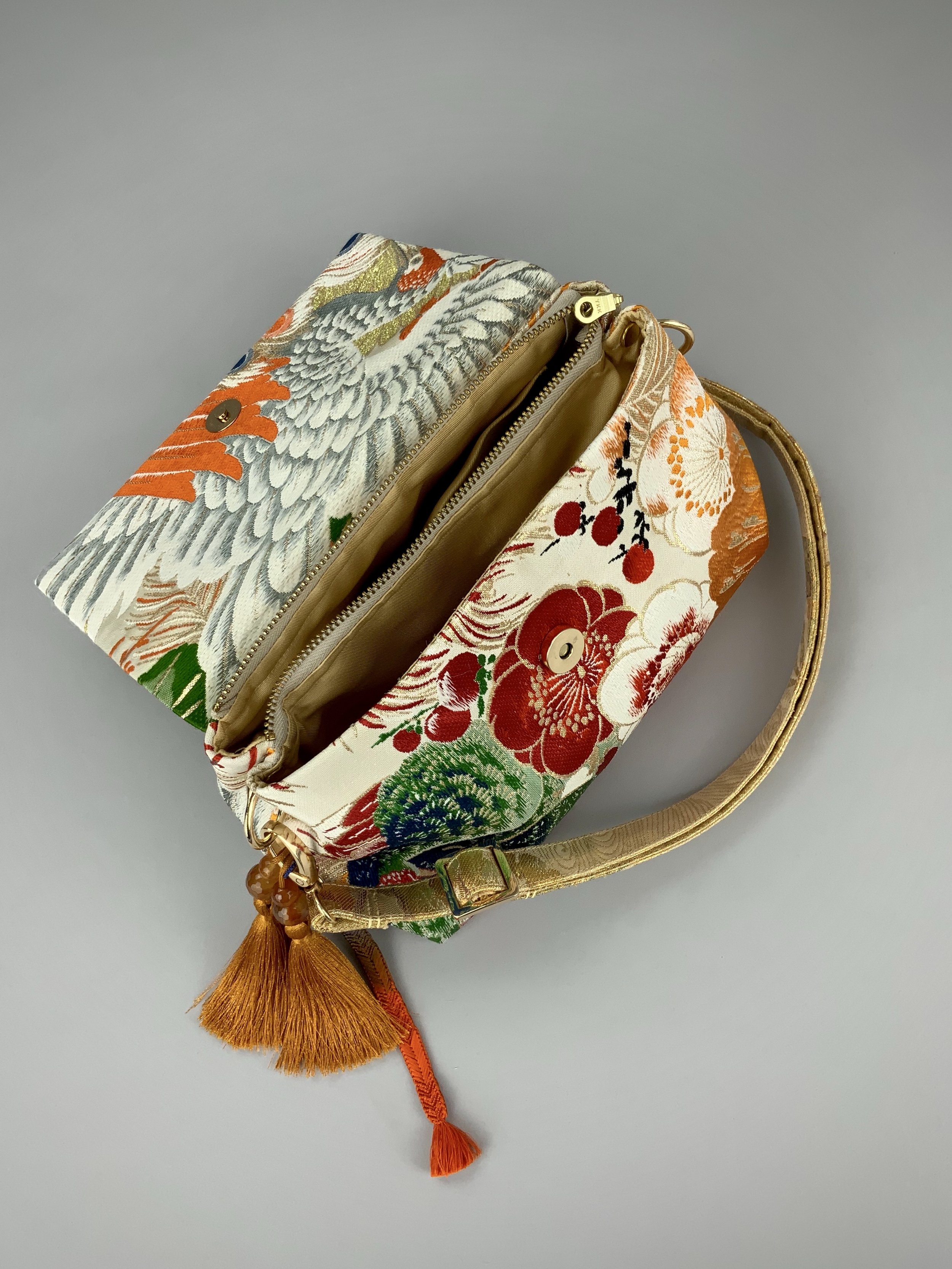 One-of-a-kind evening bag in vintage obi silk with peacock, pine motifs & gold accents