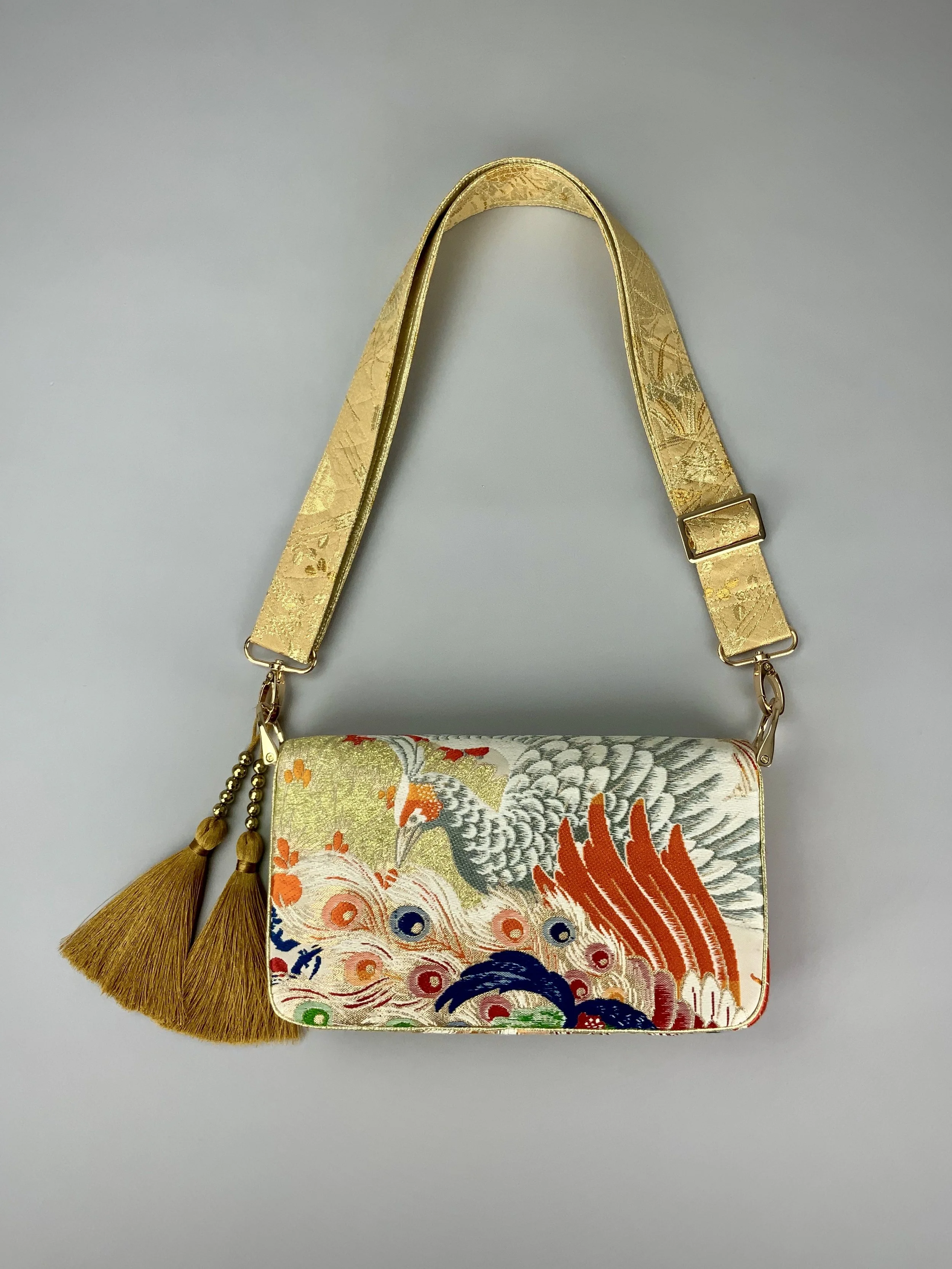 Unique evening bag in vintage obi silk with peacock, pine motifs & gold accents by Kirsty Chivers