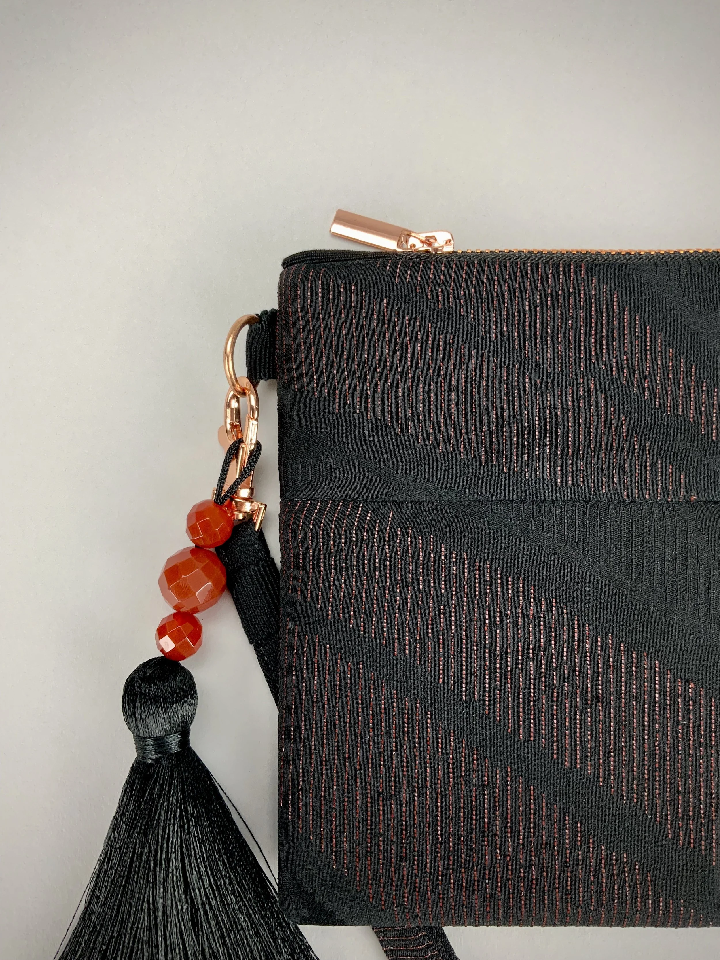 Black silk wristlet purse with urushi bamboo leaf design & silk tassel, made from vintage Japanese kimono fabric by Kirsty Chivers