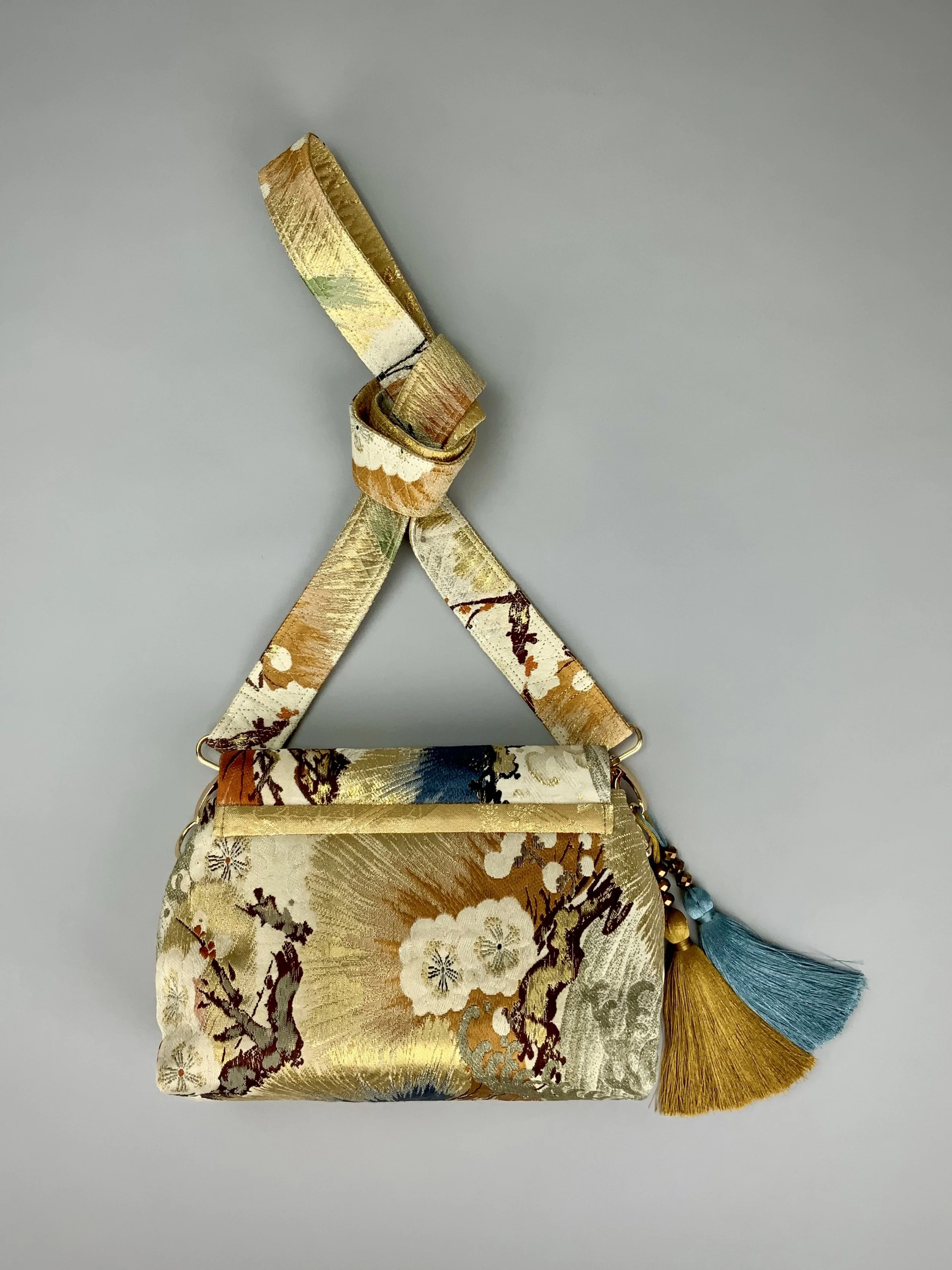 Metallic gold evening bag with Matsu pine and blossom design, made from vintage obi silk by Kirsty Chivers