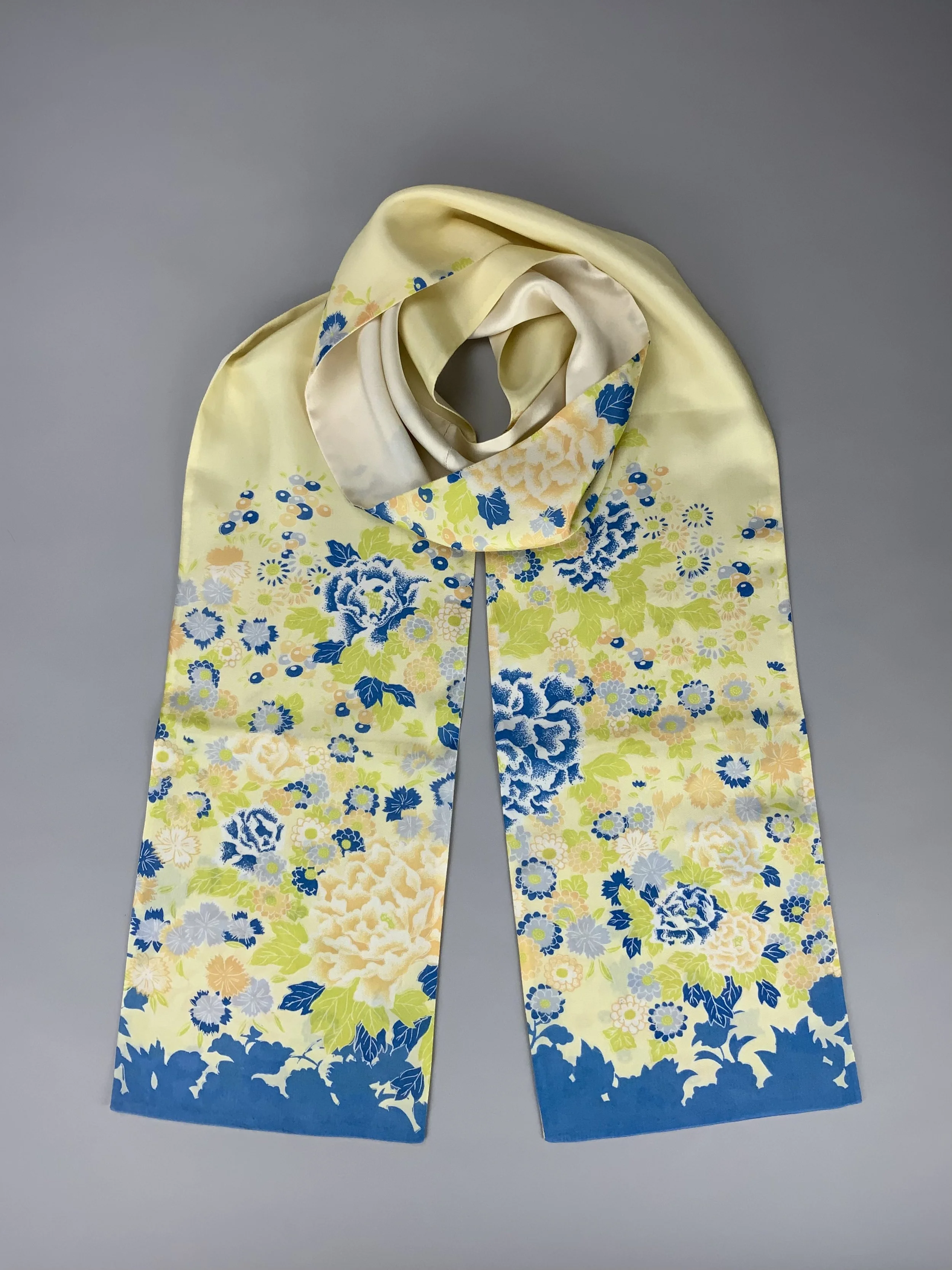 Flatlay of yellow scarf with blossom print handmade from kimono fabric and silk satin by Kirsty Chivers